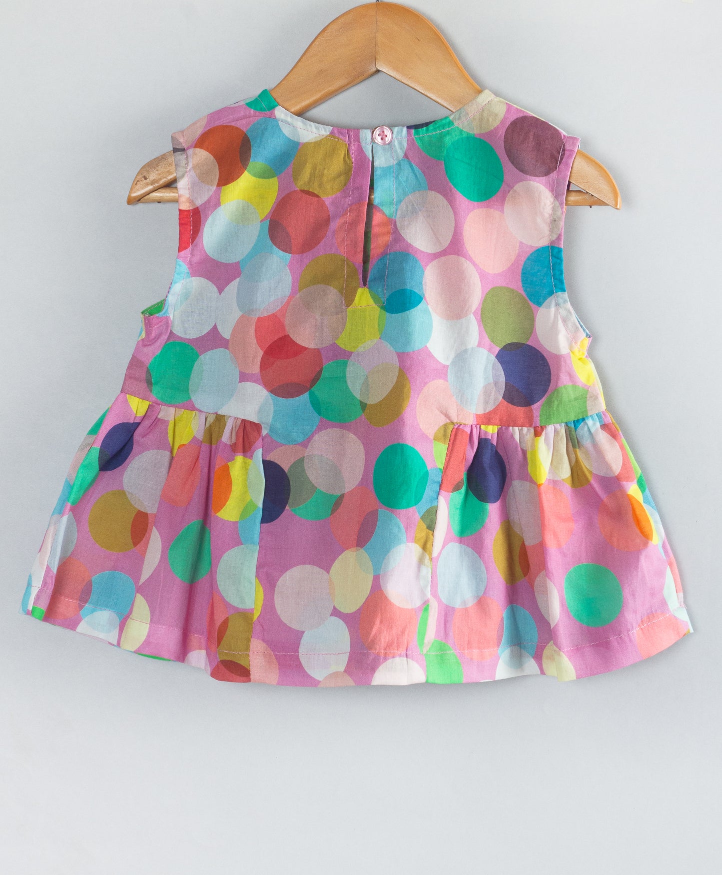 MULTI DOT PRINT TOP WITH CONTRAST BOW