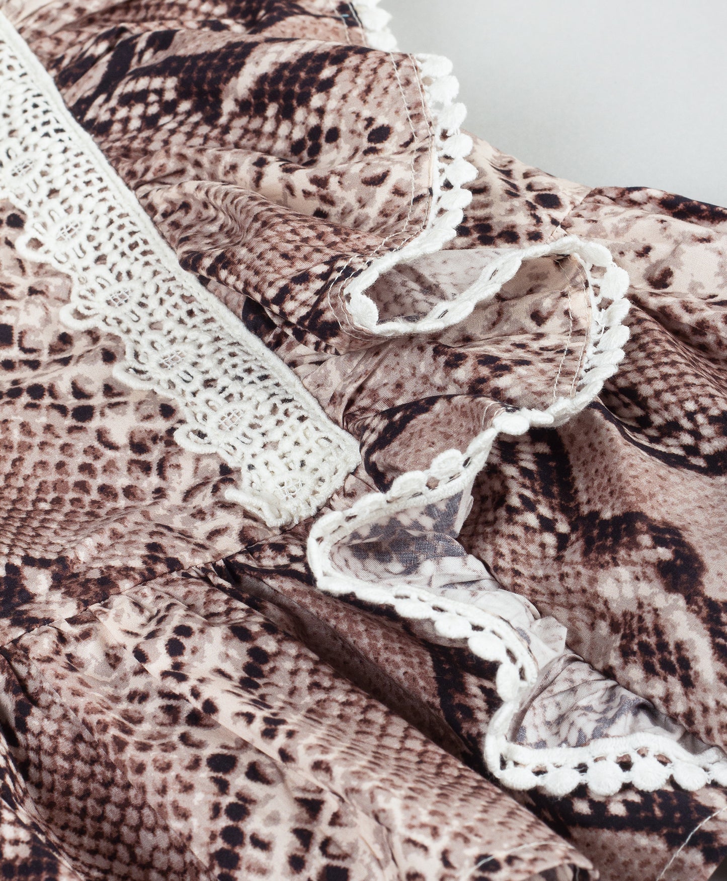 ANIMAL SKIN PRINT PEPLUM TOP