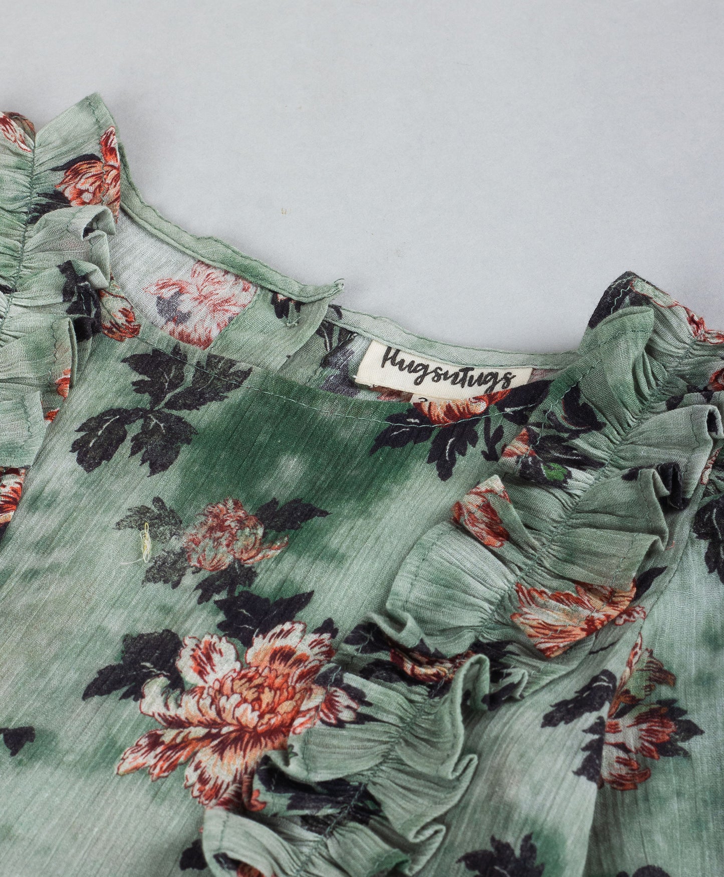 GREEN FLORAL PRINTED TOP WITH FRONT SIDE FRILLS