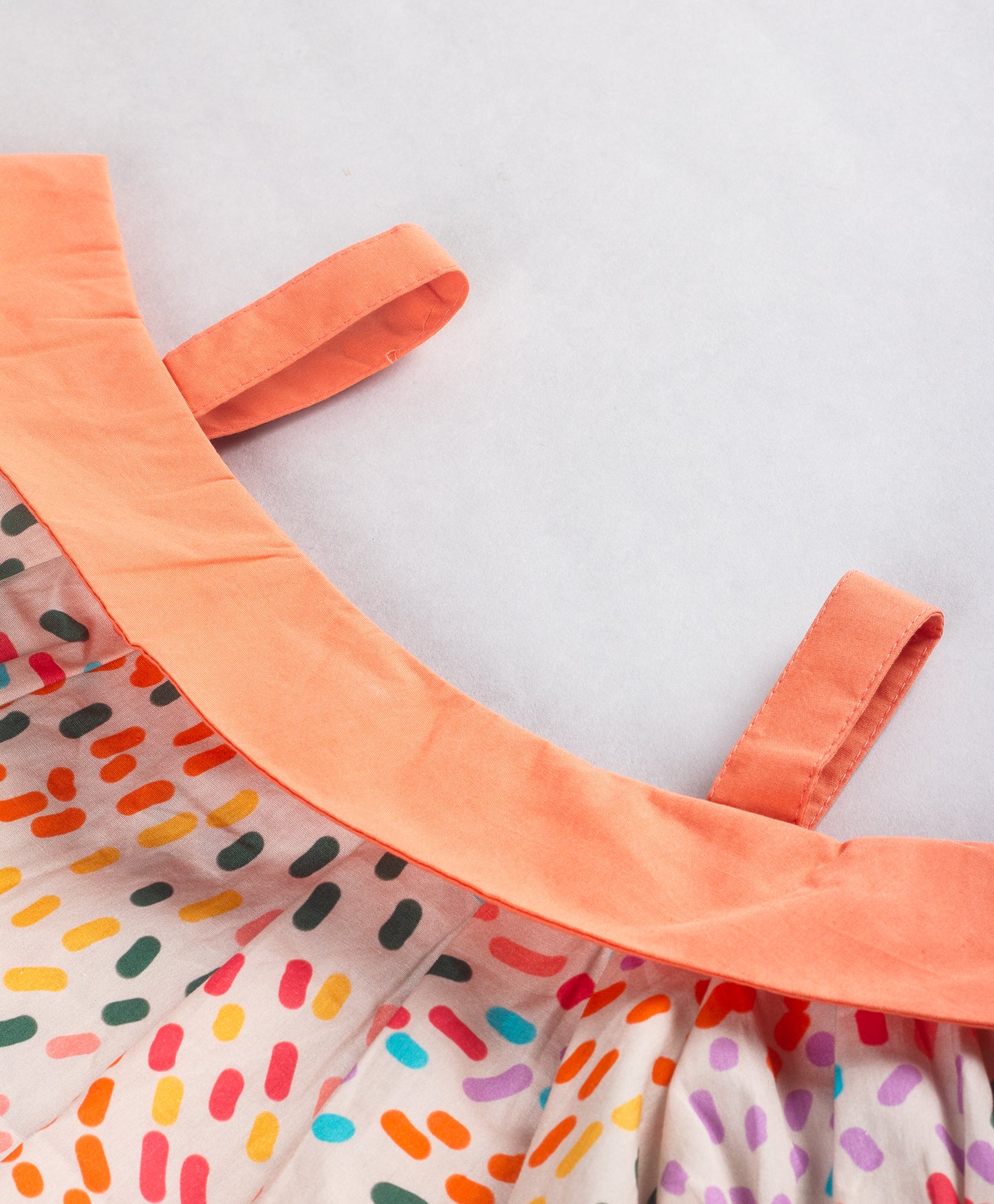 CONFETTI PRINT COLD SHOULDER TOP