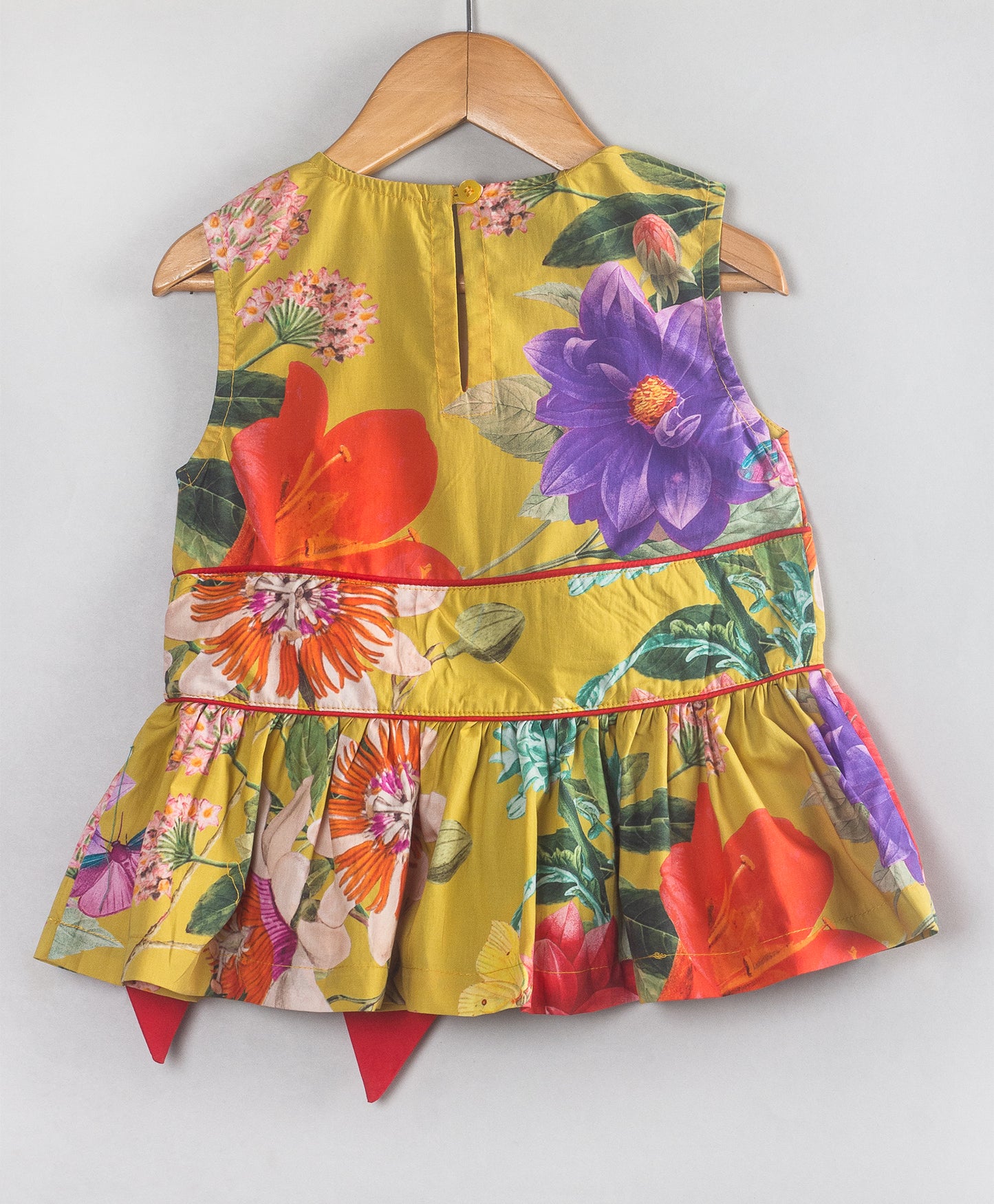 YELLOW FLORAL PRINT TOP WITH RED BOW AT WAIST