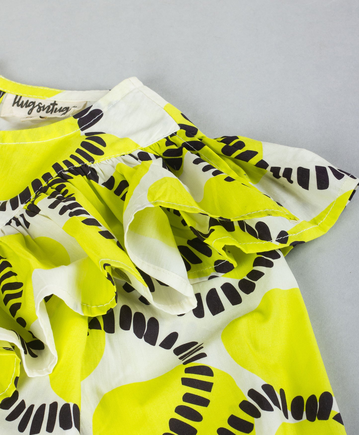 CIRCLE PRINT TOP WITH FRILL ACROSS FRONT