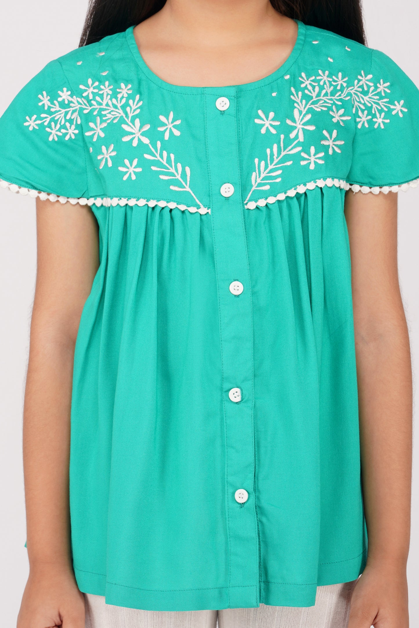 SOLID GREEN TOP WITH ECRU EMBROIDERY ON THE YOKE