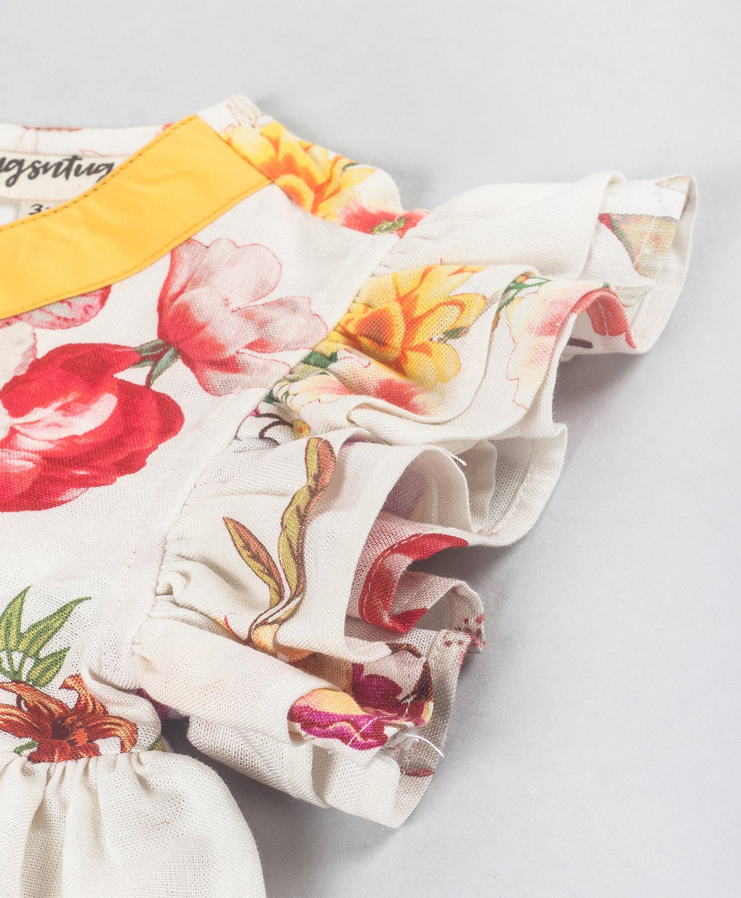 FLORAL PRINT TOP WITH YELLOW TIE UP AT NECK