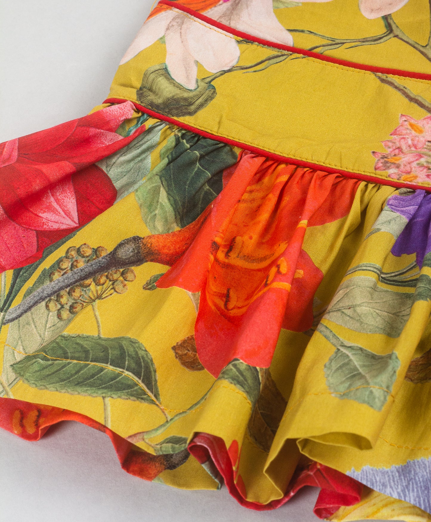YELLOW FLORAL PRINT TOP WITH RED BOW AT WAIST