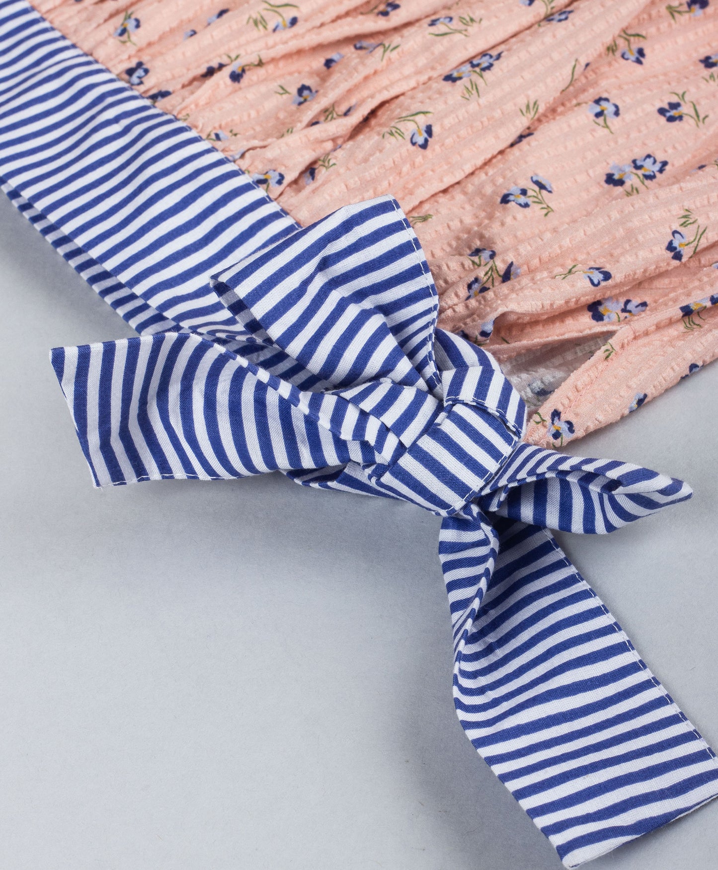 PEACH DITSY PRINT TOP WITH STRIPED TIE UP AT BOTTOM