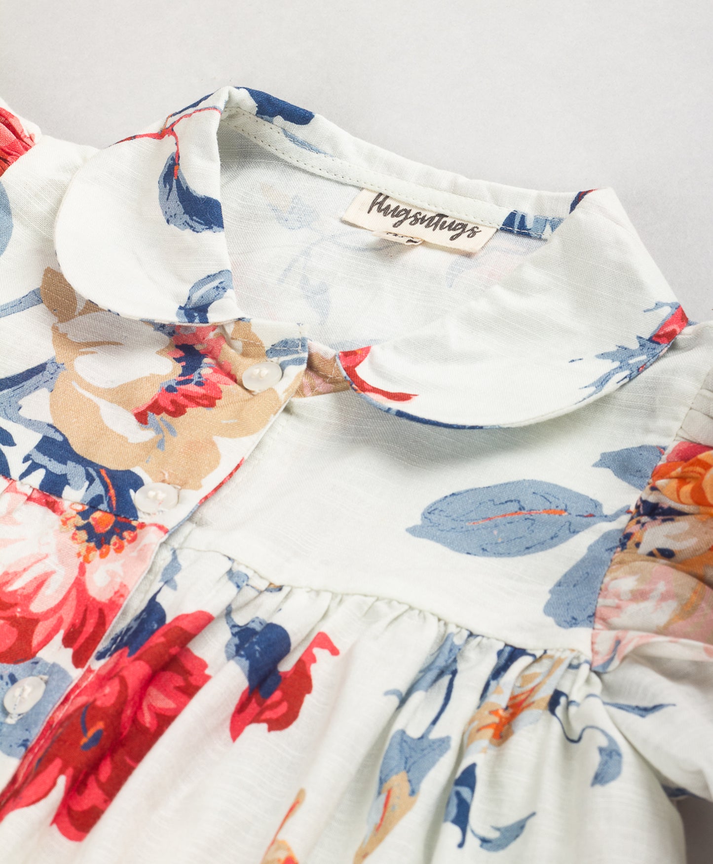 WHITE FLORAL PRINT TOP WITH FRILLS AT SHOULDER