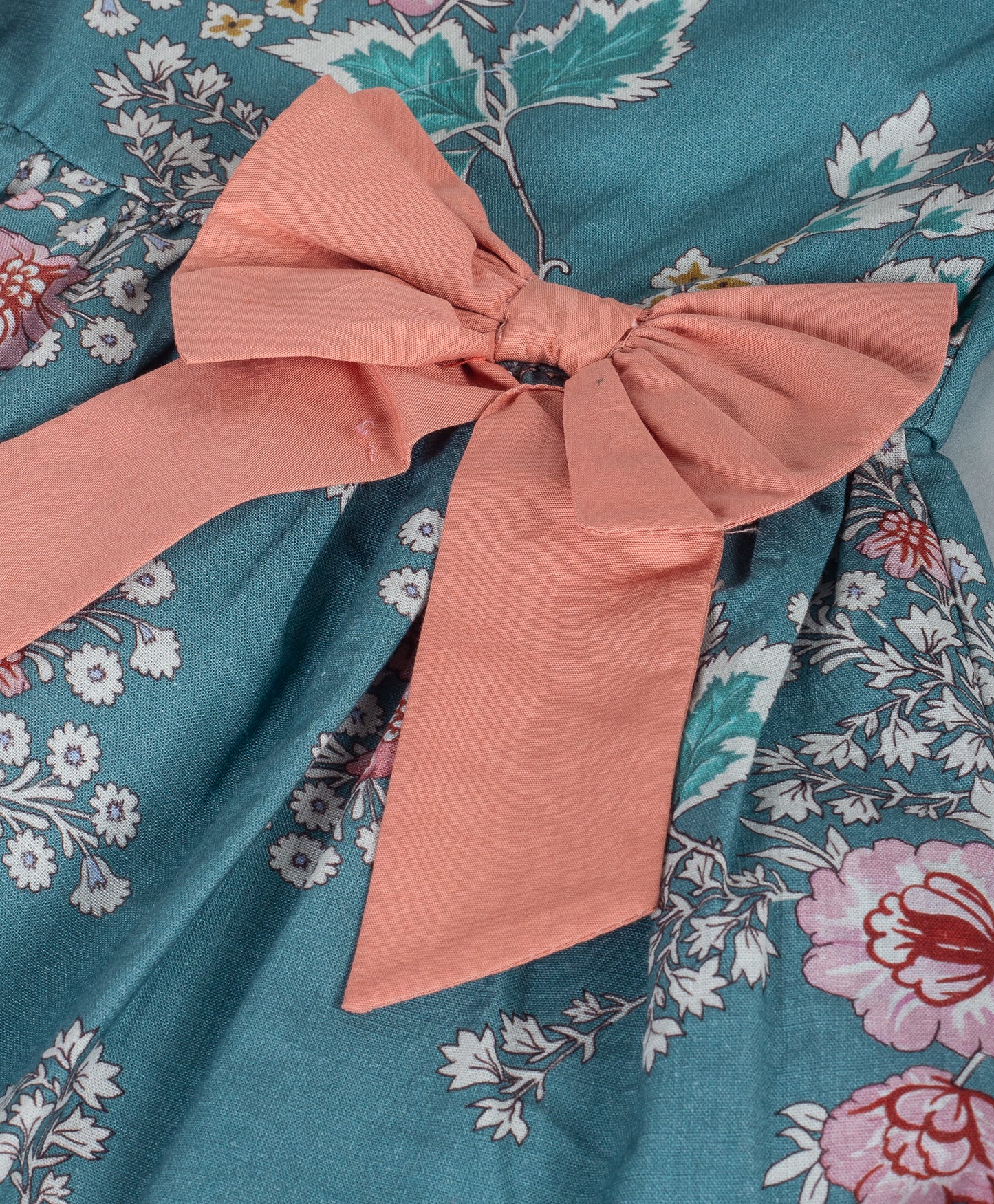 TEAL BLUE FLOWER PRINT DRESS WITH CORAL BOWS ON SIDE WAIST