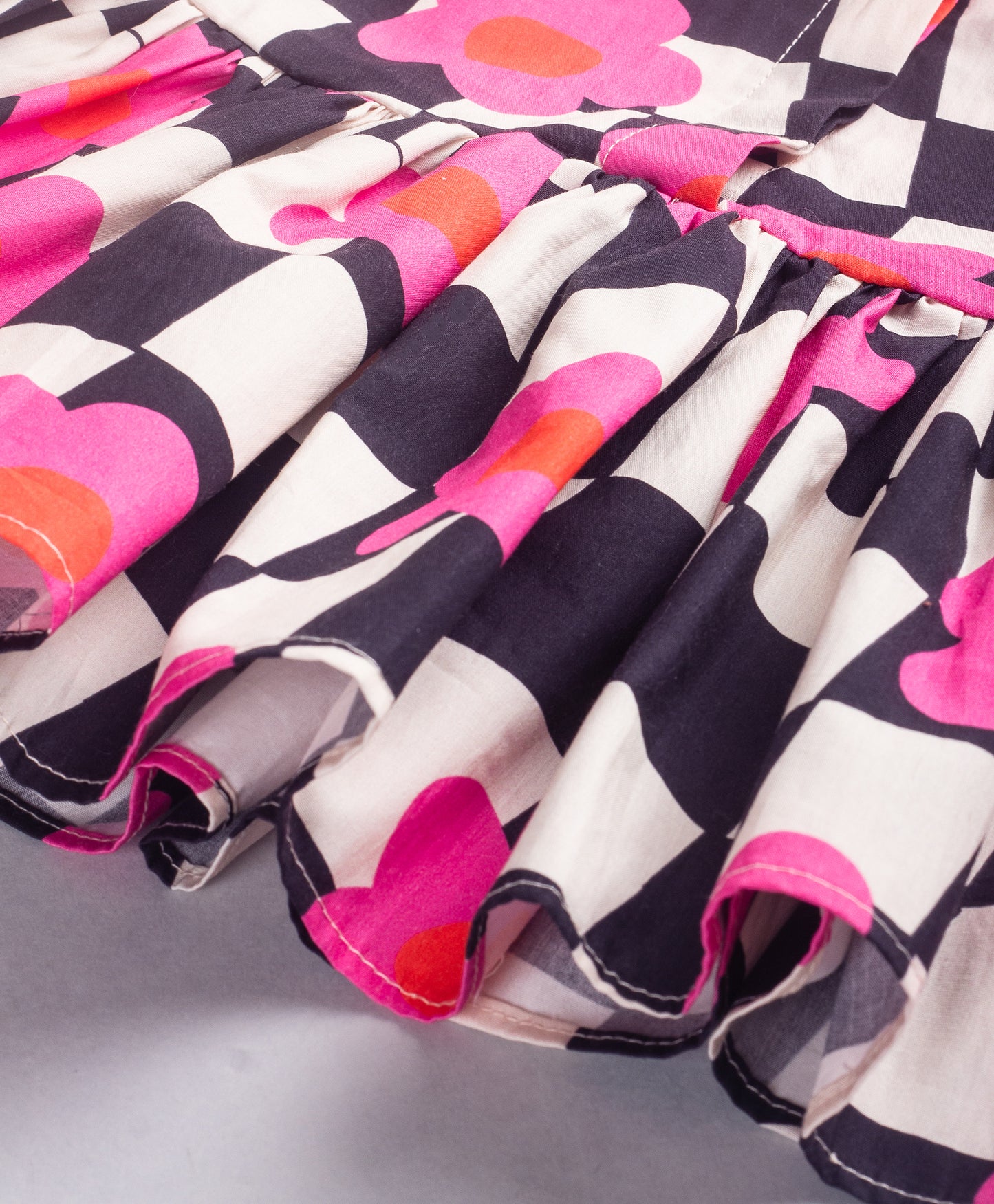 BLACK AND WHITE CHECK PRINT PEPLUM TOP