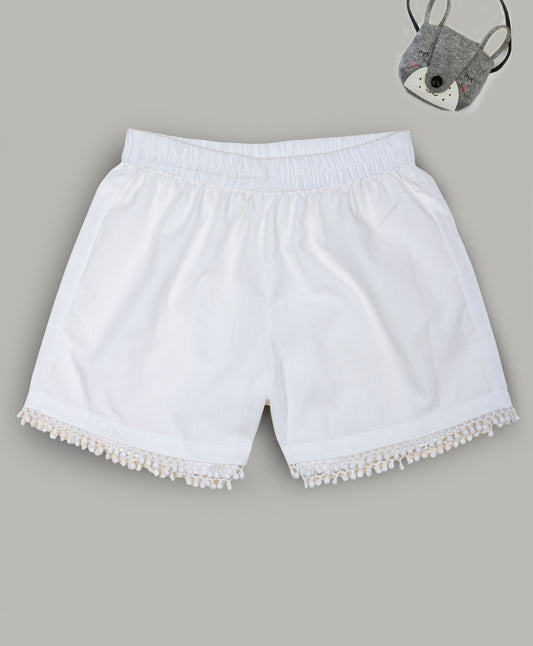Solid White shorts with pom pom lace detailing at the bottom