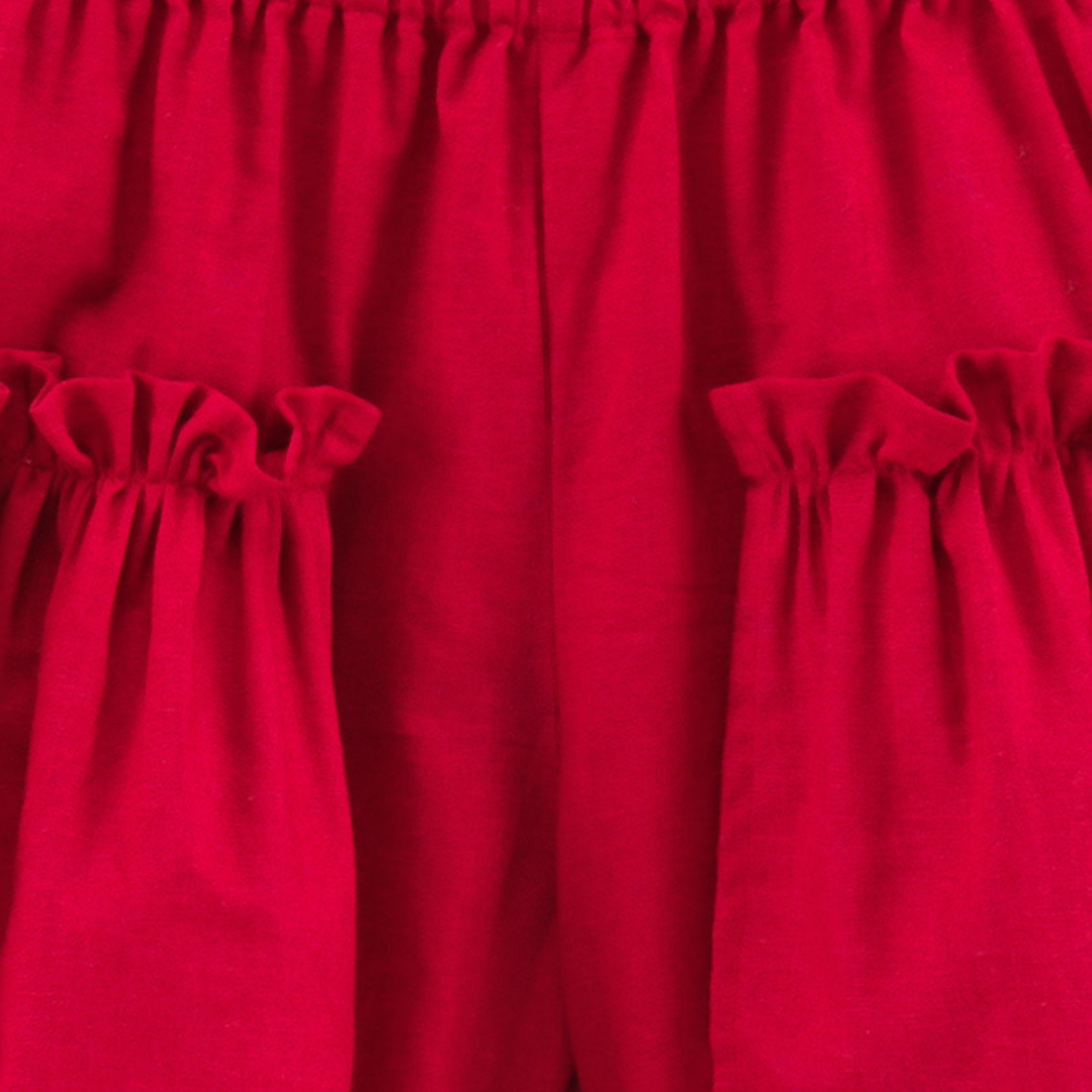 Maroon shorts with ruffles on side
