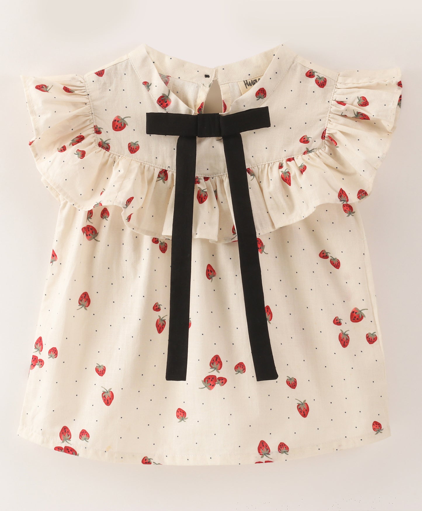 White top with strawberry and dot print with black bow tie at neck