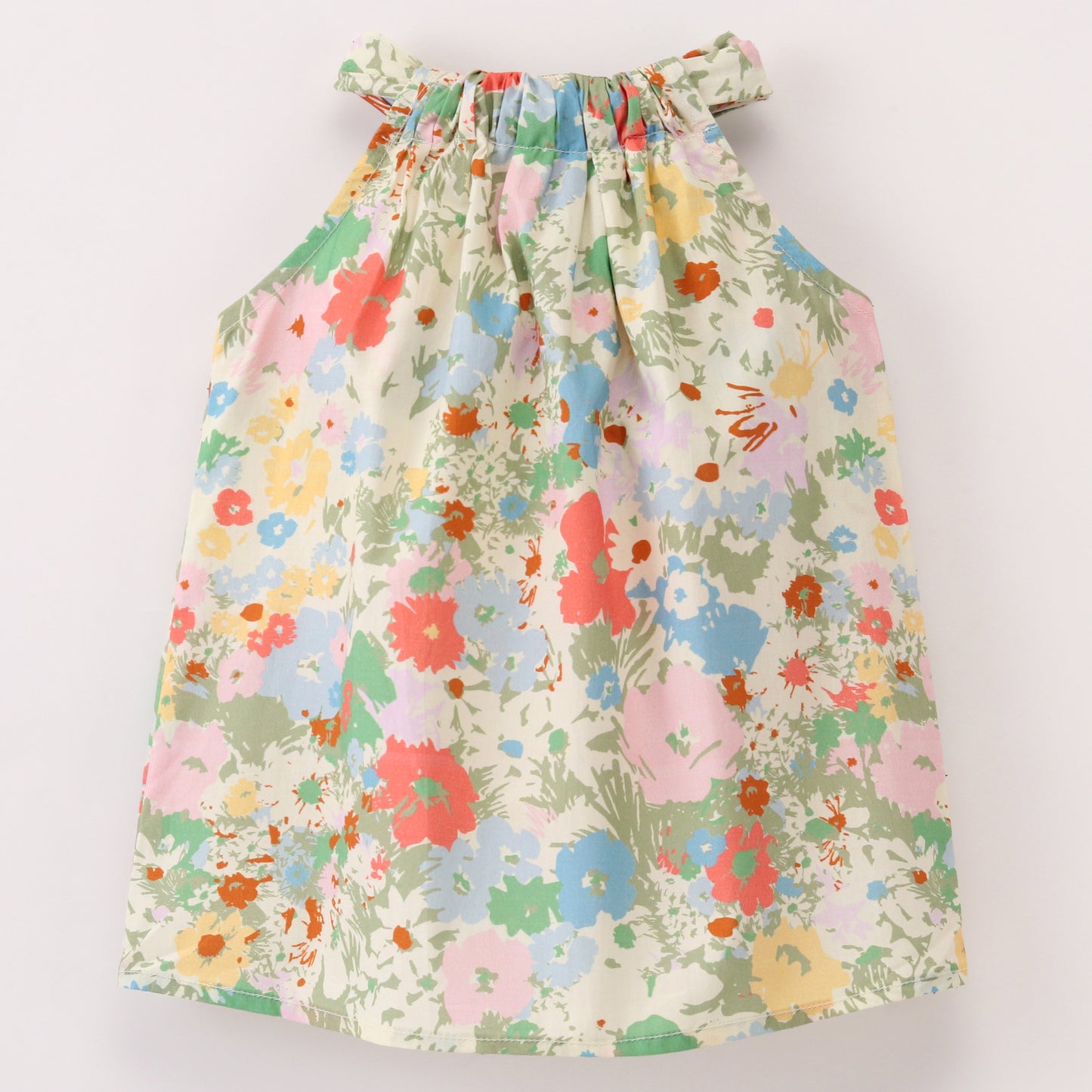 Pastel Floral print top with cut out at back and tie up at back neck