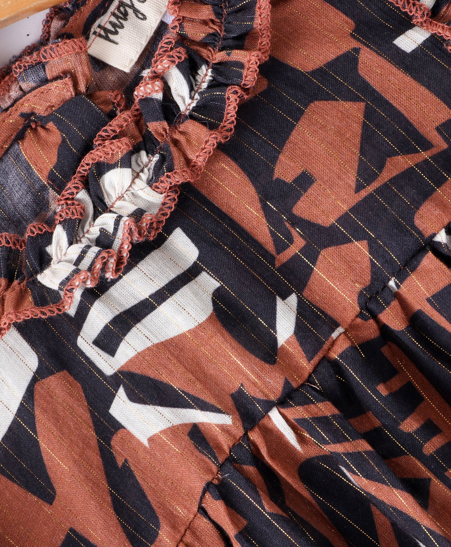 Full Sleeve Seamless Alphabets Printed & Swiss Dobby Work Detailed & Lurex Striped Ruffled Top - Brown
