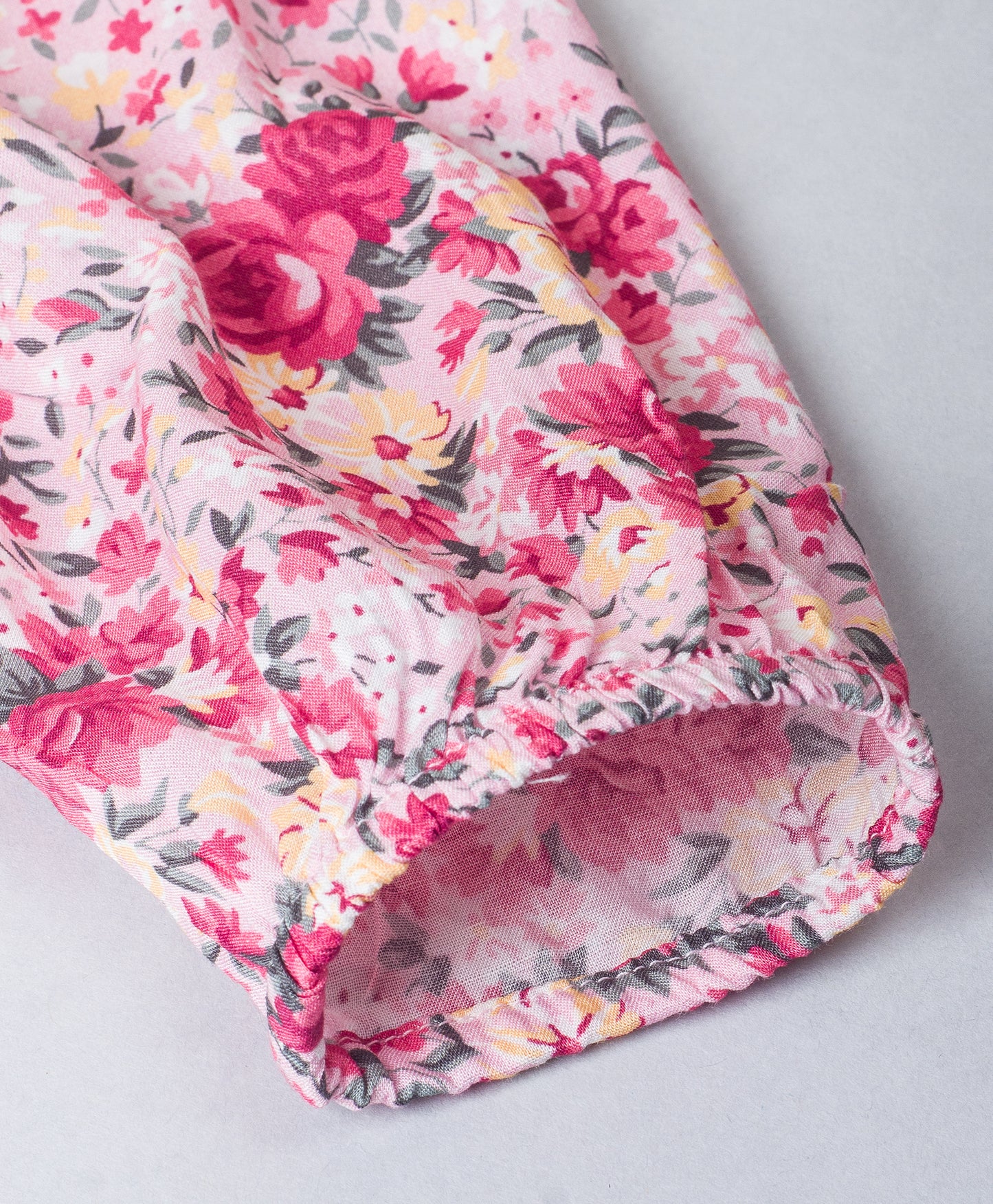 Pink Floral top with frills on the shoulder