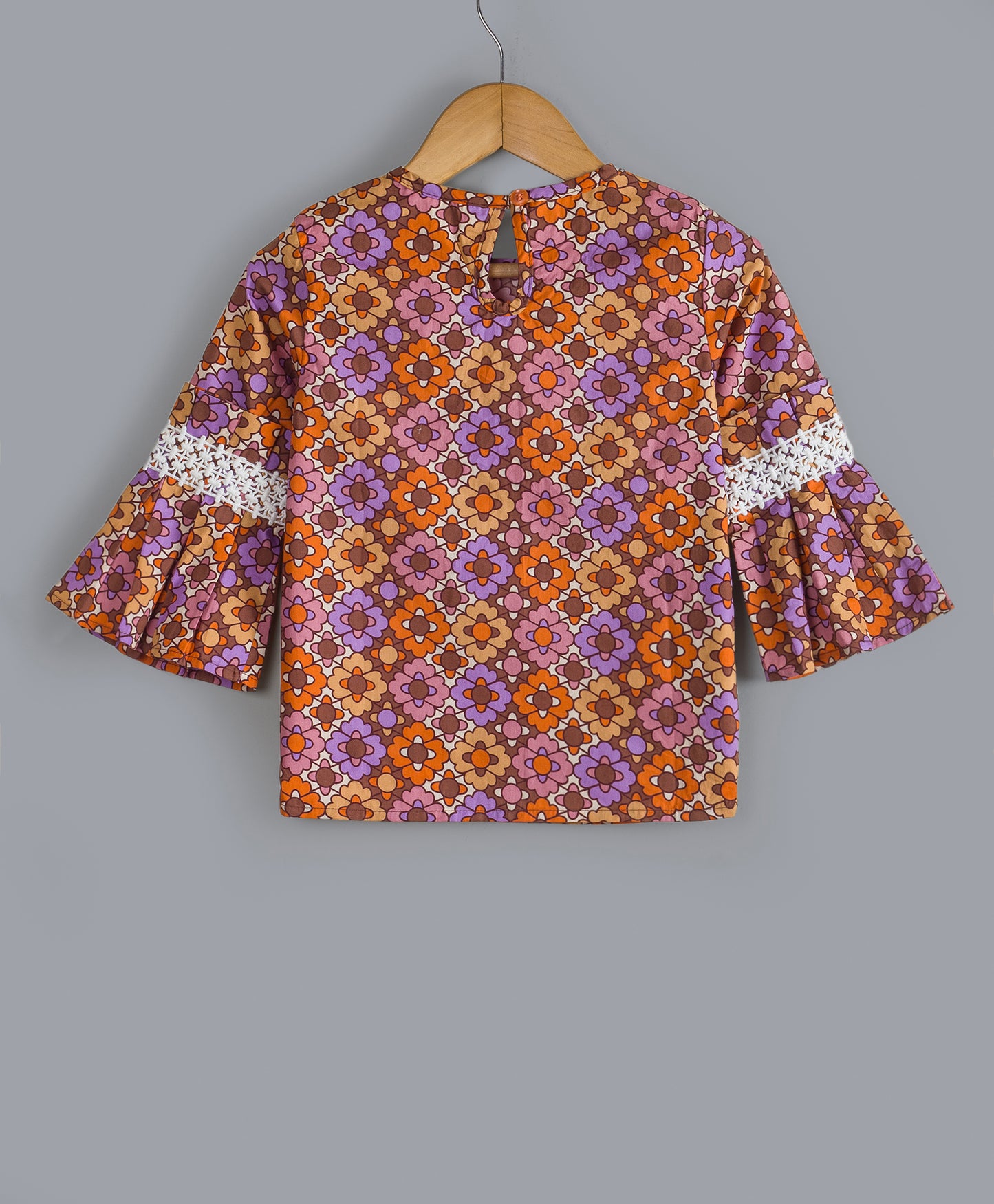 GEOMETRIC FLORAL PRINT TOP WITH BELL SLEEVES AND CONTRAST LACE ON SLEEVES