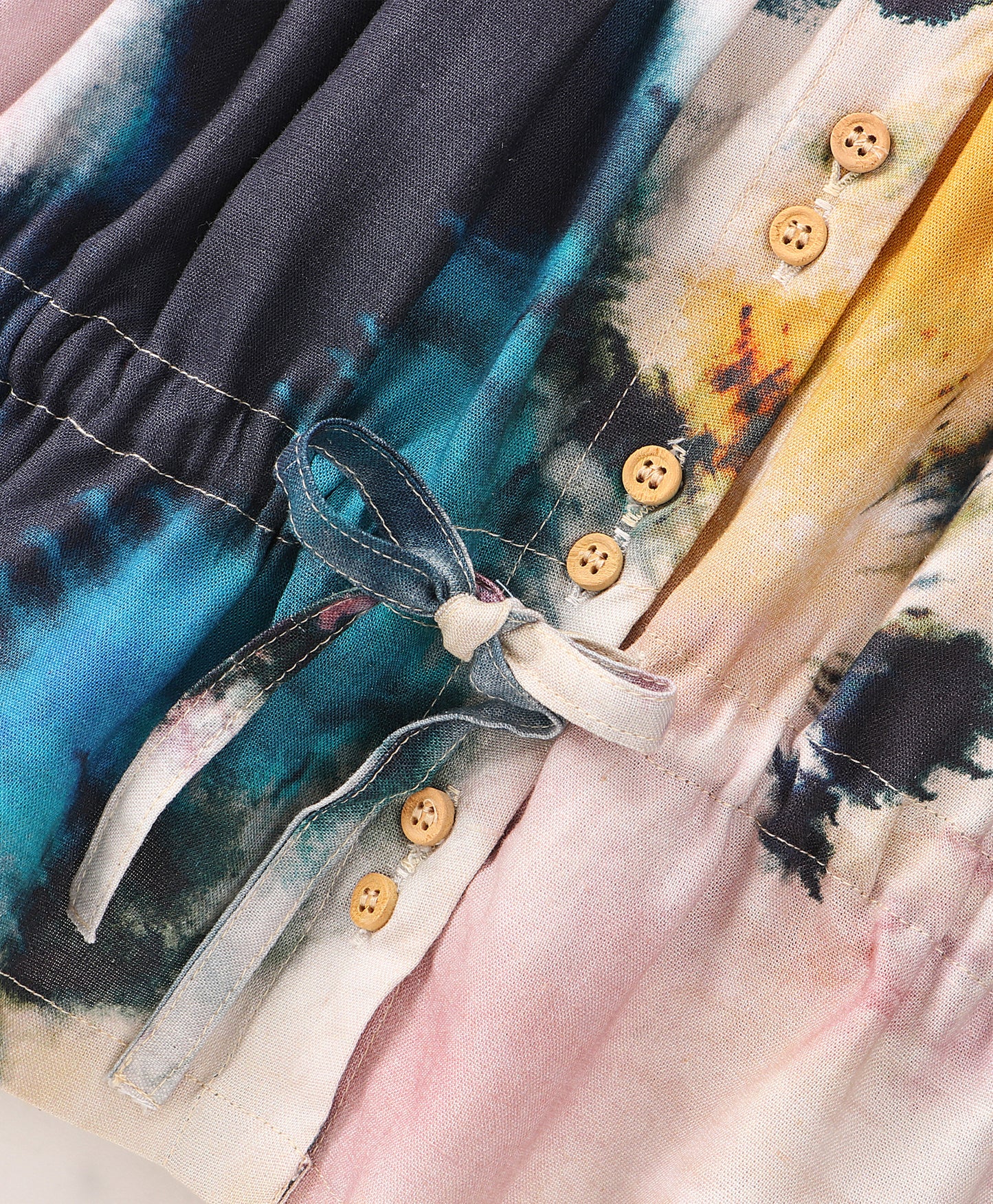 WATER COLOR EFFECT TOP WITH WOODEN BUTTONS AT FRONT