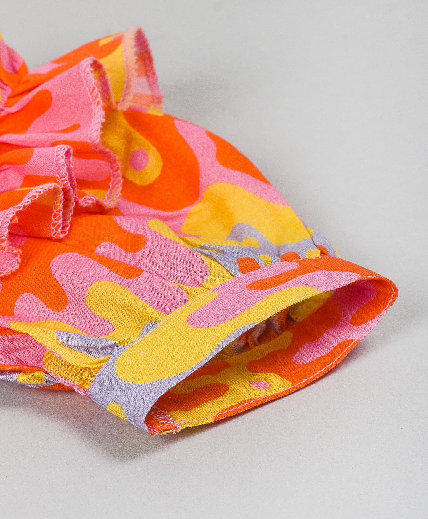 ORANGE AND GREY GEOMETRIC PRINT TOP WITH FRILLS AT ARMHOLE