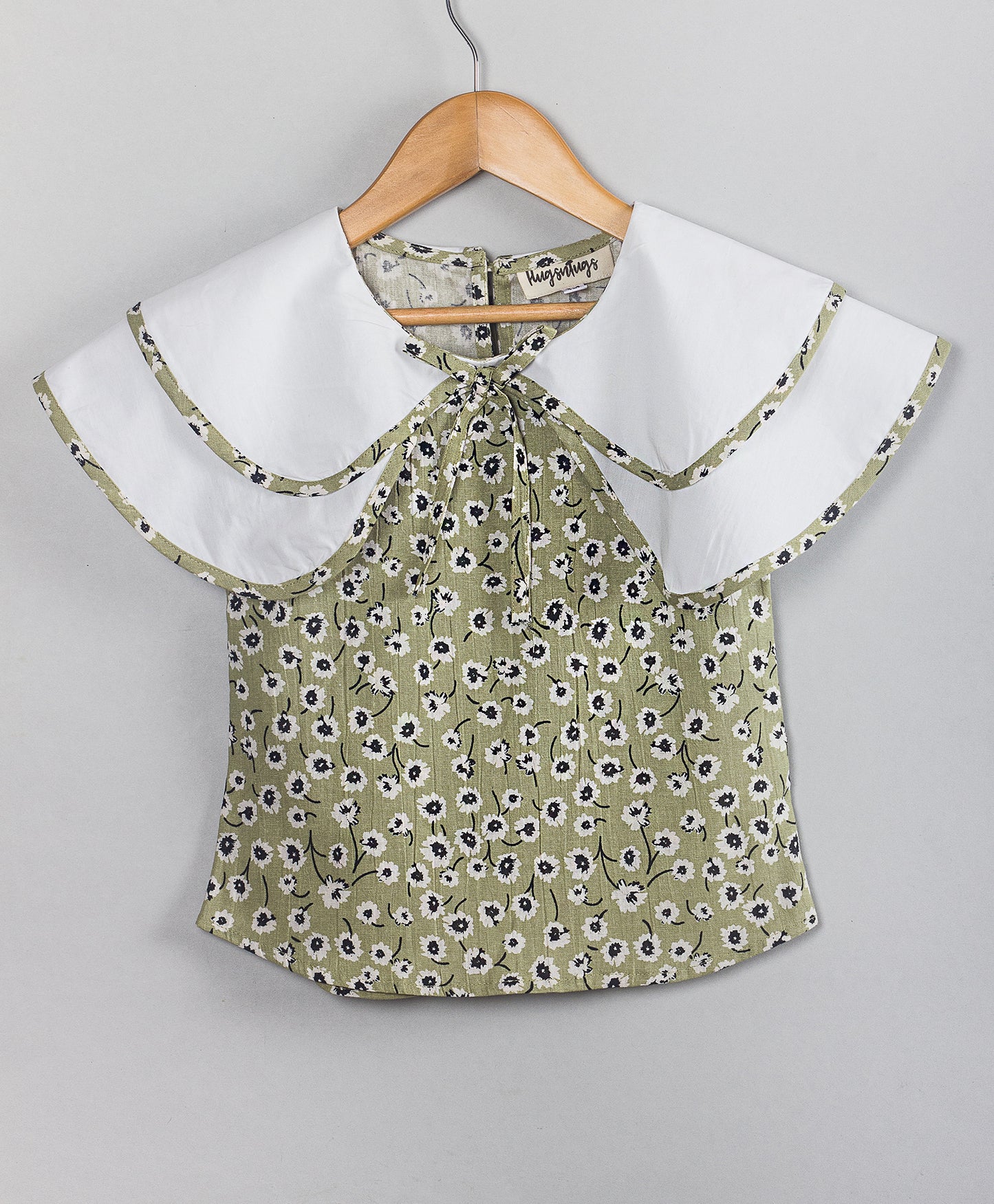 OLIVE GREEN FLORAL PRINT TOP WITH SOLID WHITE DOUBLE SHOULDER FLAPS