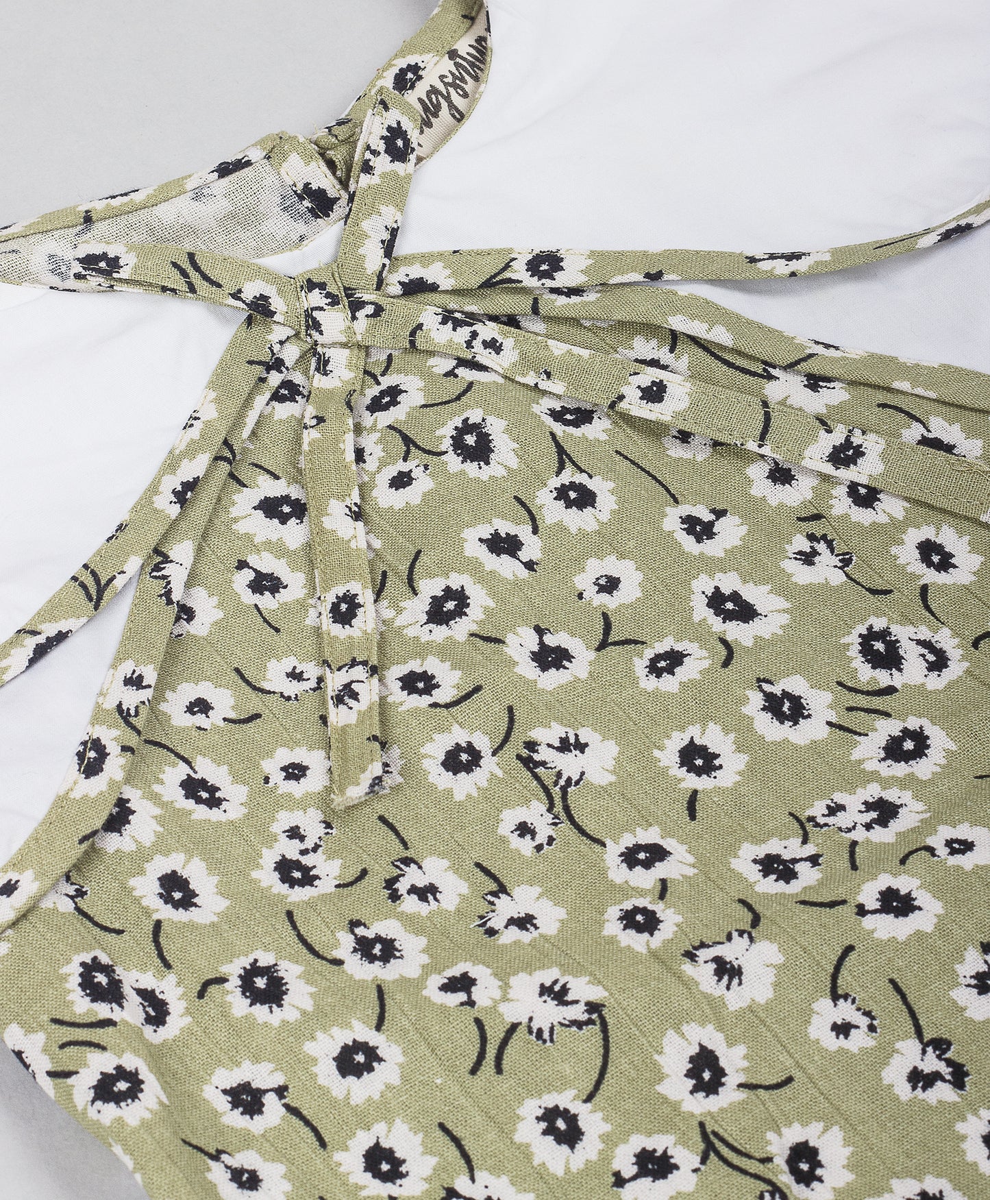 OLIVE GREEN FLORAL PRINT TOP WITH SOLID WHITE DOUBLE SHOULDER FLAPS