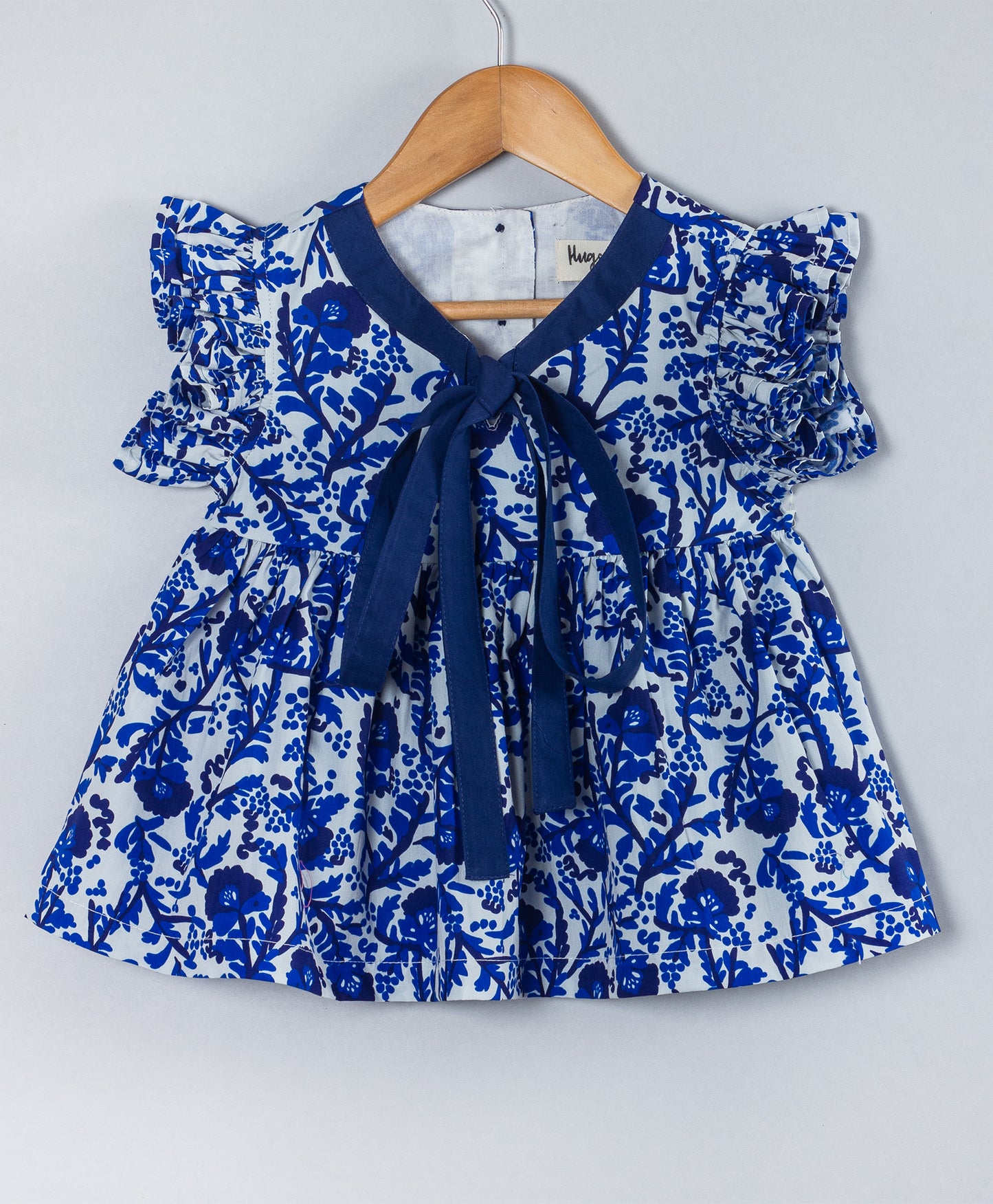 BLUE ALL OVER FLORAL PRINT WITH TIE UP AT NECK