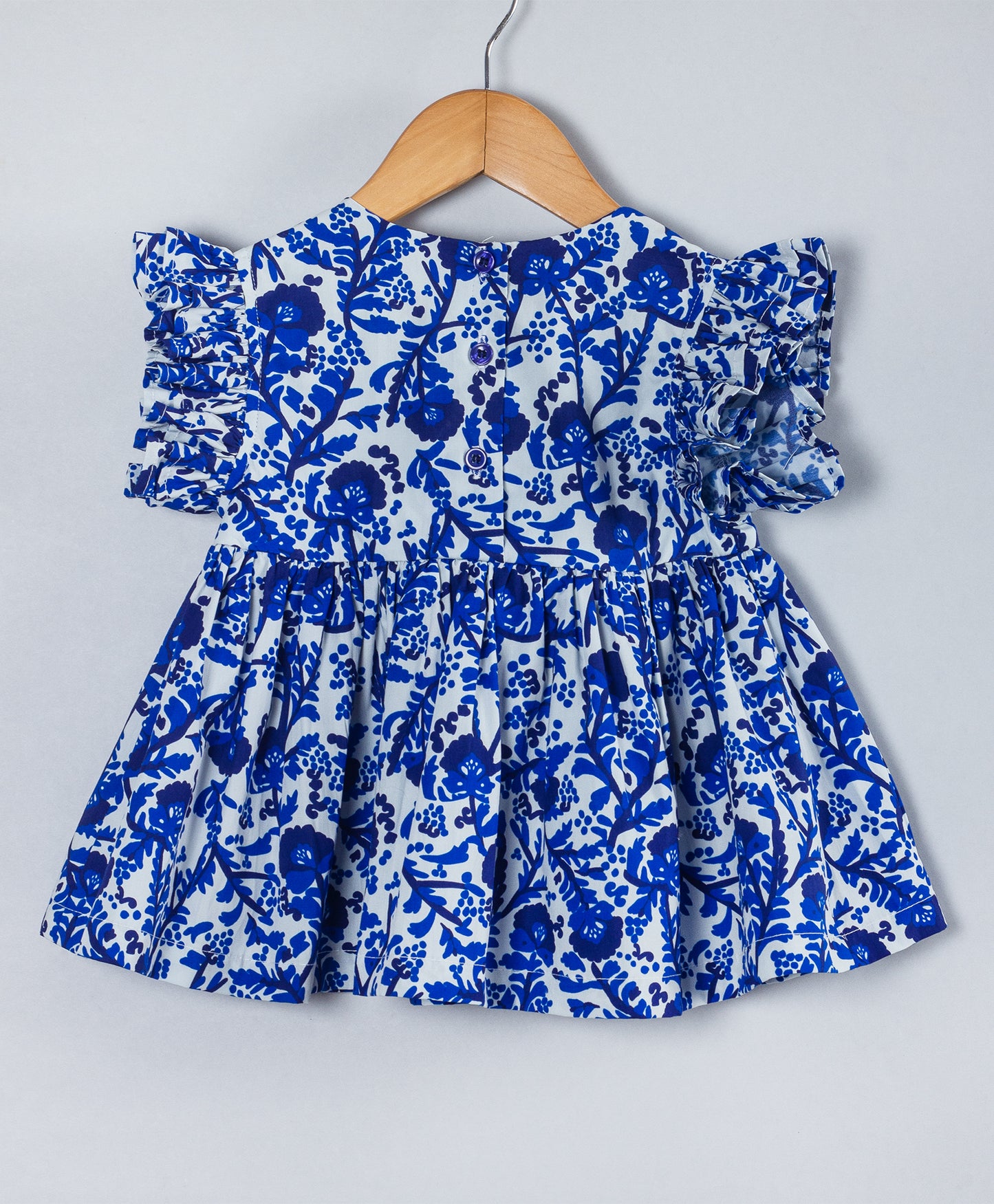 BLUE ALL OVER FLORAL PRINT WITH TIE UP AT NECK