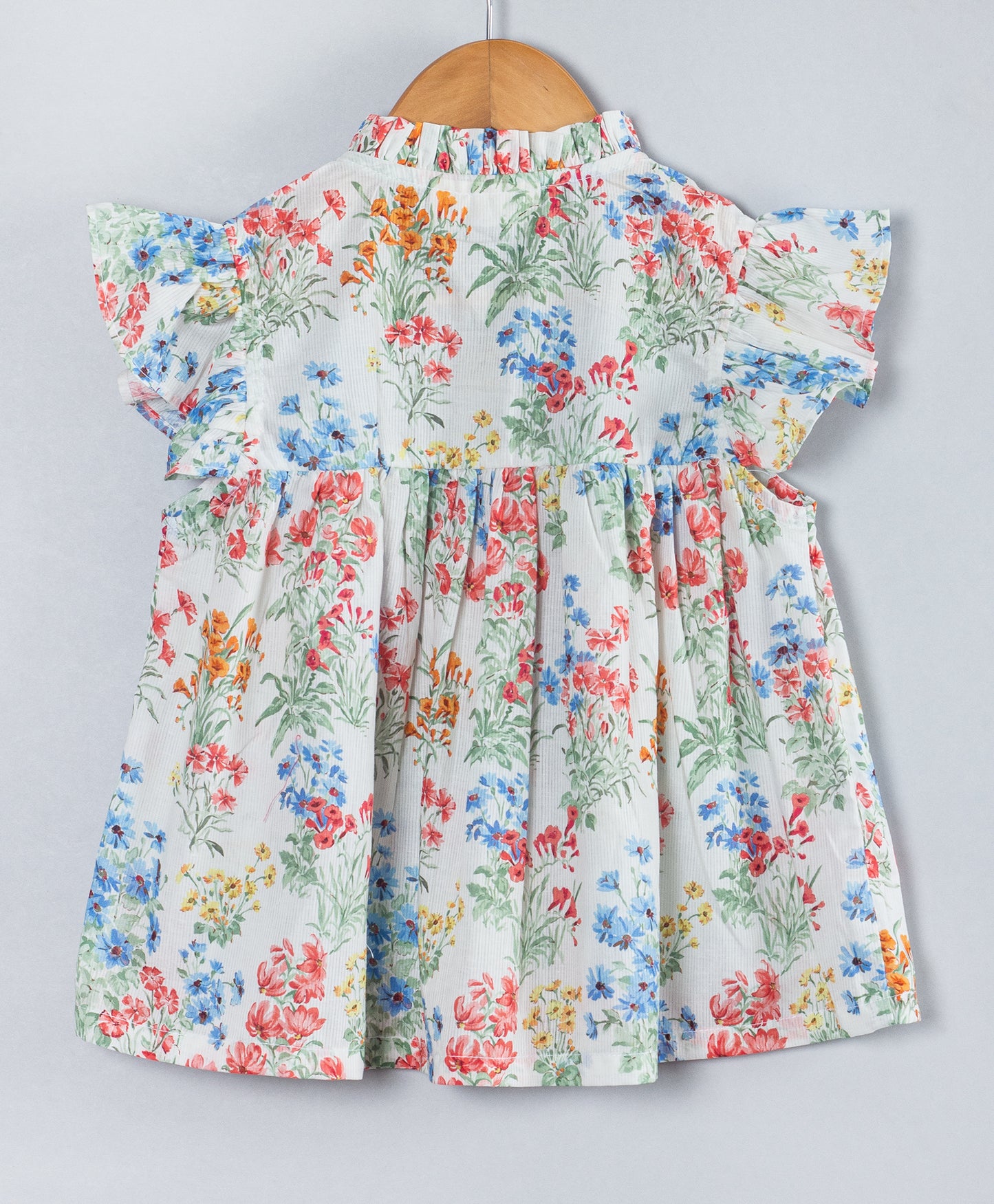MULTI FLORAL PRINT TOP WITH FRILLS AT NECK AND ARMHOLE