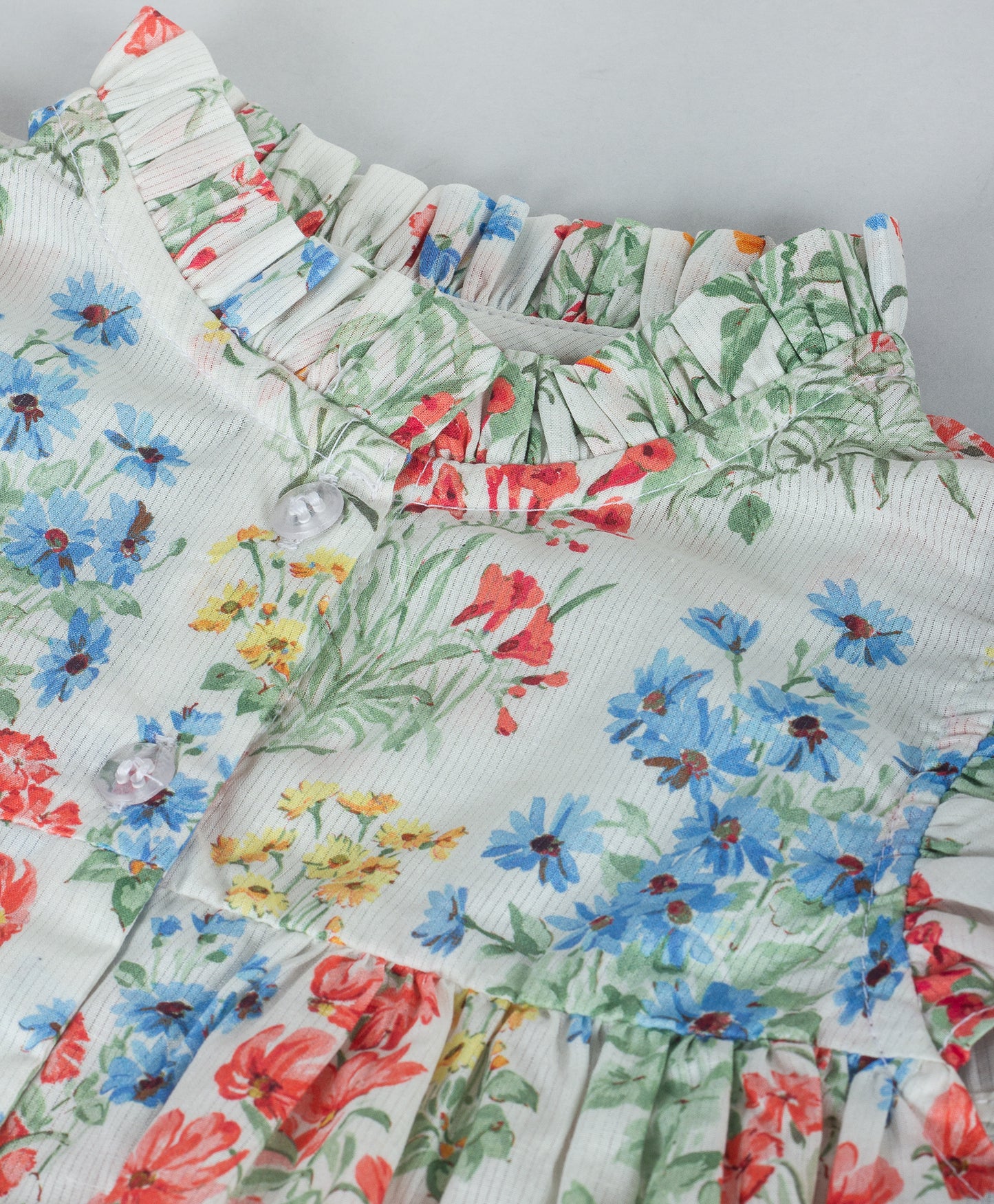 MULTI FLORAL PRINT TOP WITH FRILLS AT NECK AND ARMHOLE