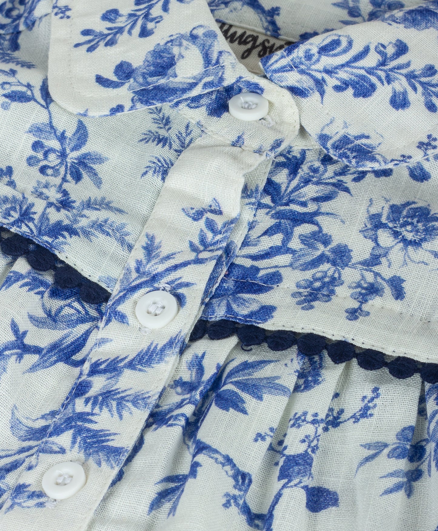 WHITE AND BLUE FLORAL TOP WITH NAVY LACE TRIMS