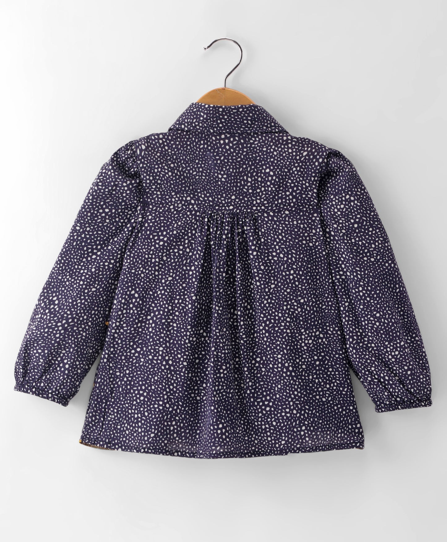 NAVY SMALL DOT PRINT TOP WITH MULTI LAYERS OF FRILLS