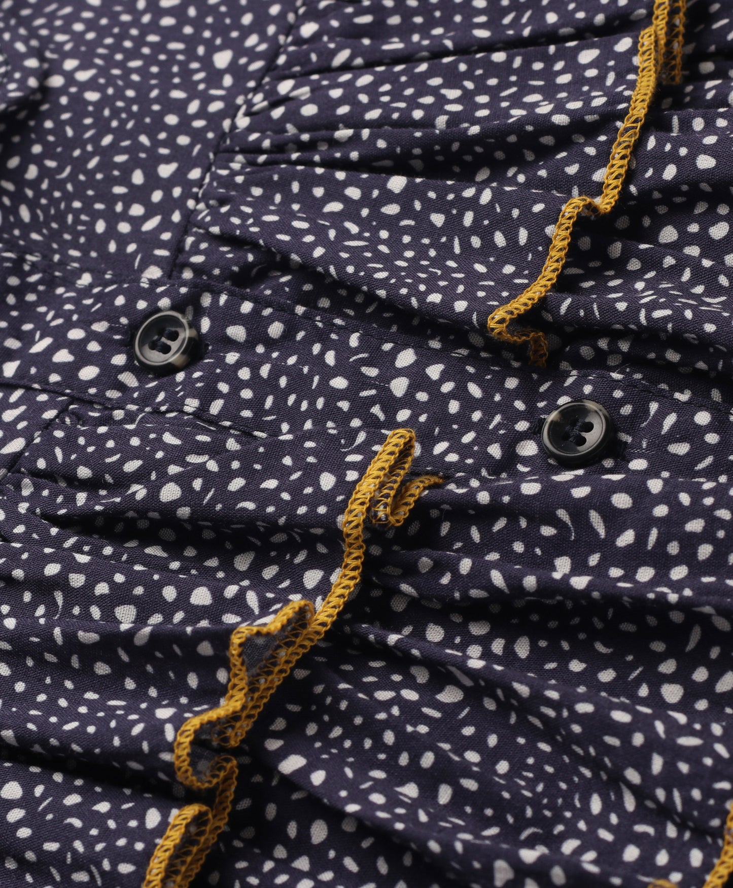 NAVY SMALL DOT PRINT TOP WITH MULTI LAYERS OF FRILLS