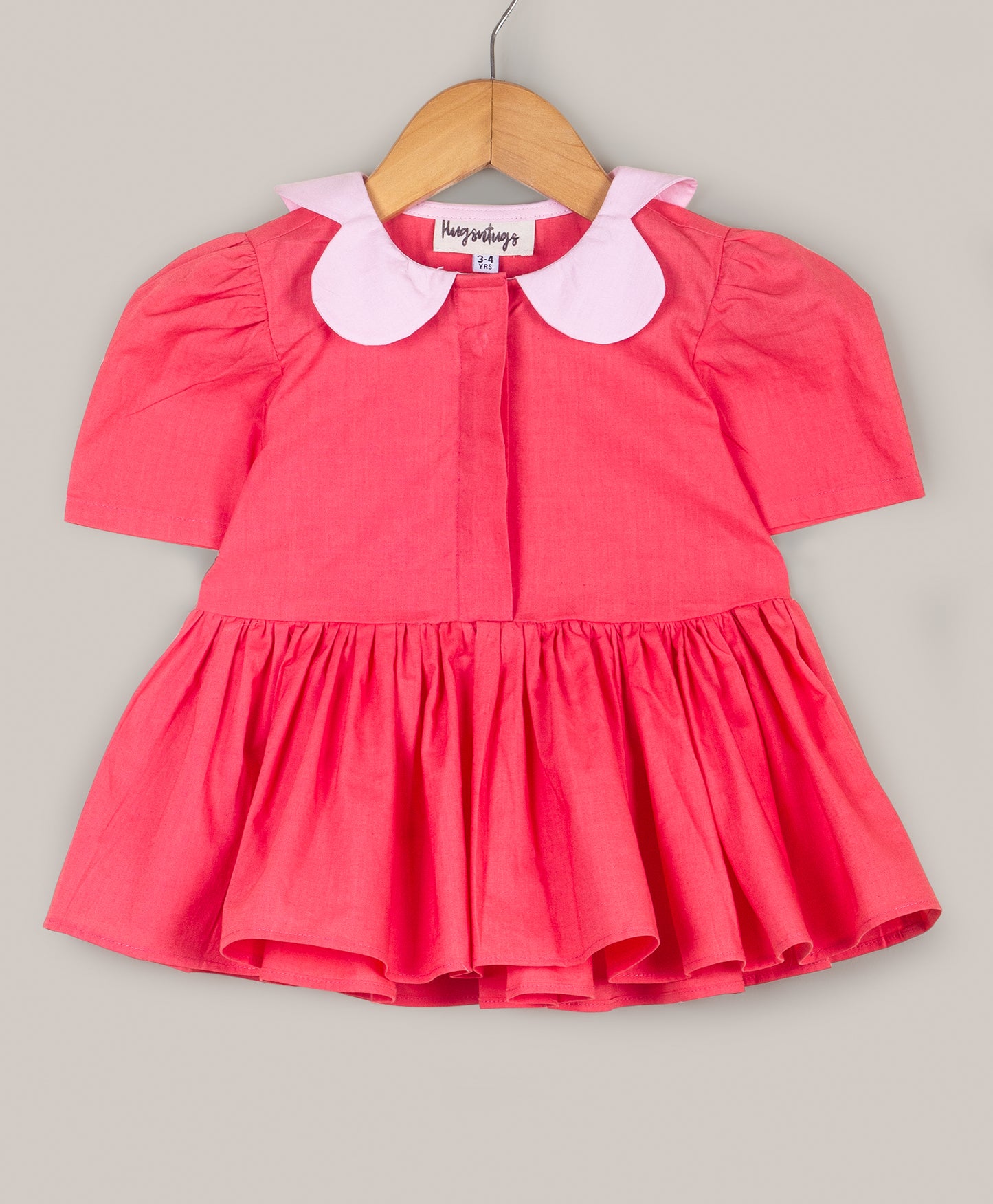 Solid Peplum top with flower shape collar