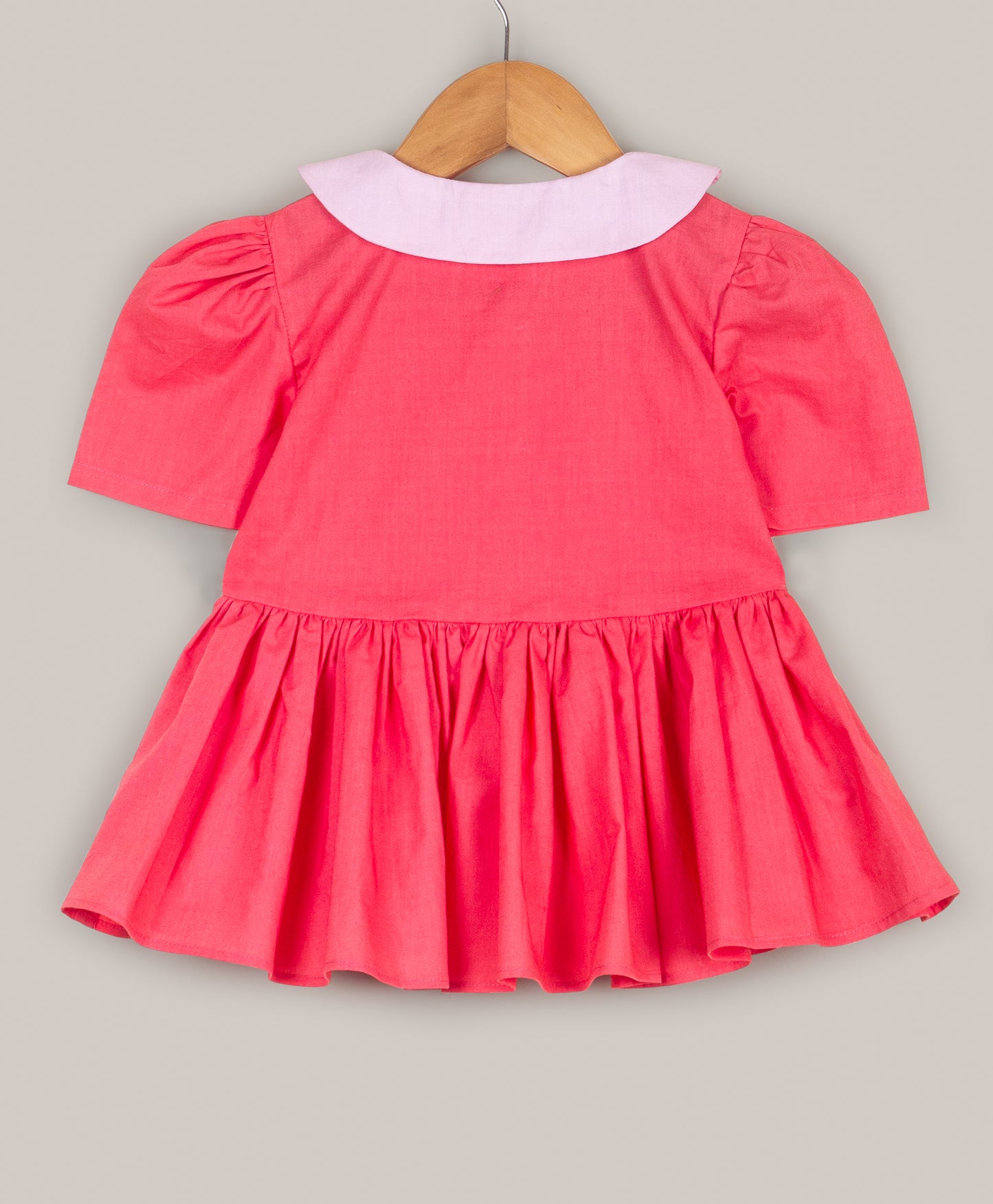 Solid Peplum top with flower shape collar