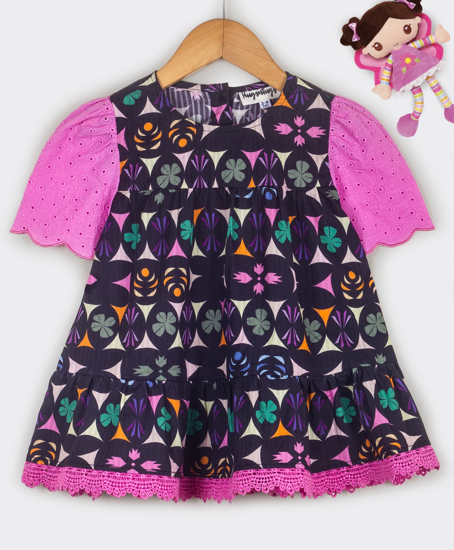 Kaleidoscopic print top with schiffli sleeves