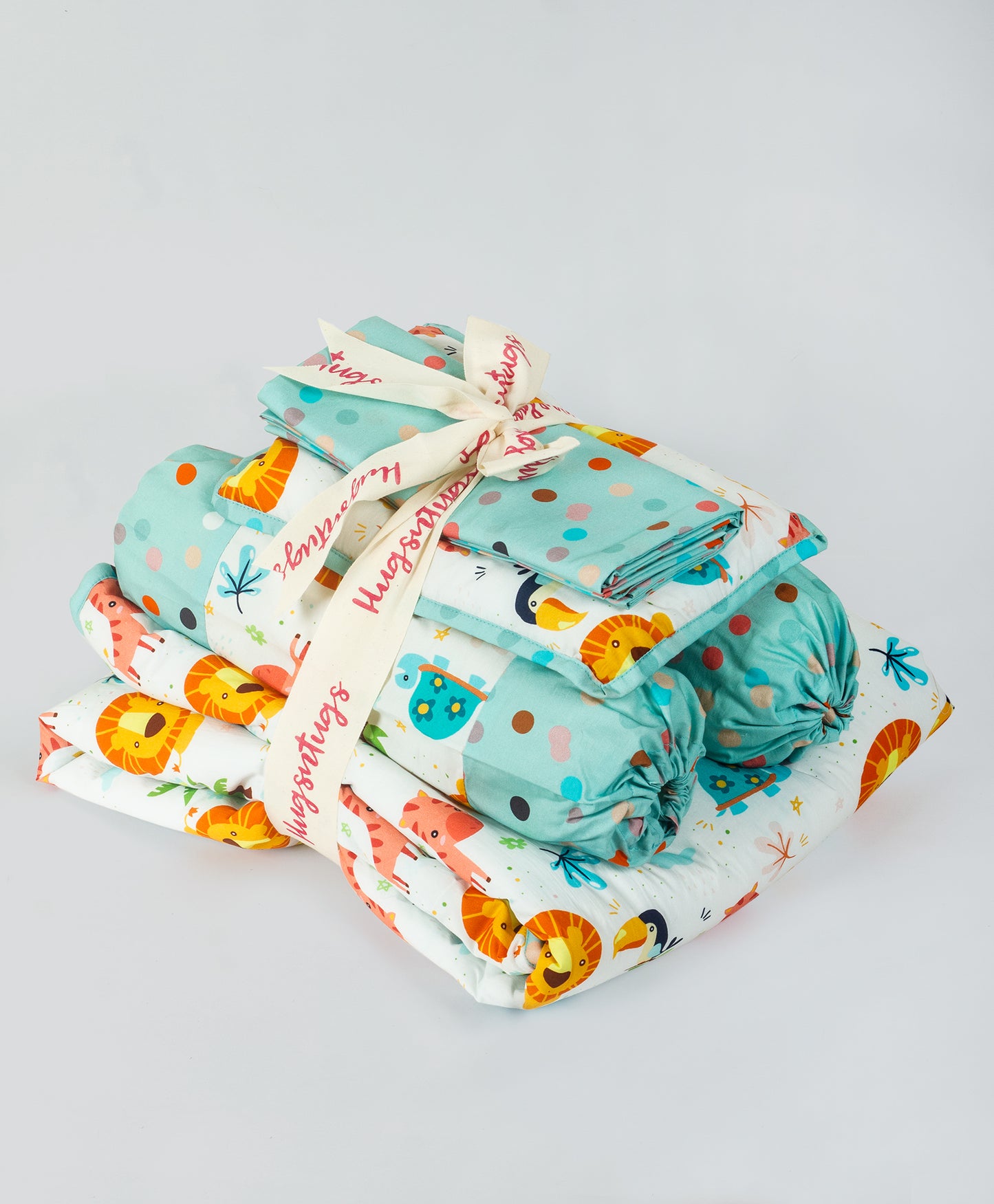 multi jungle print cot set with aqua multi dot side print