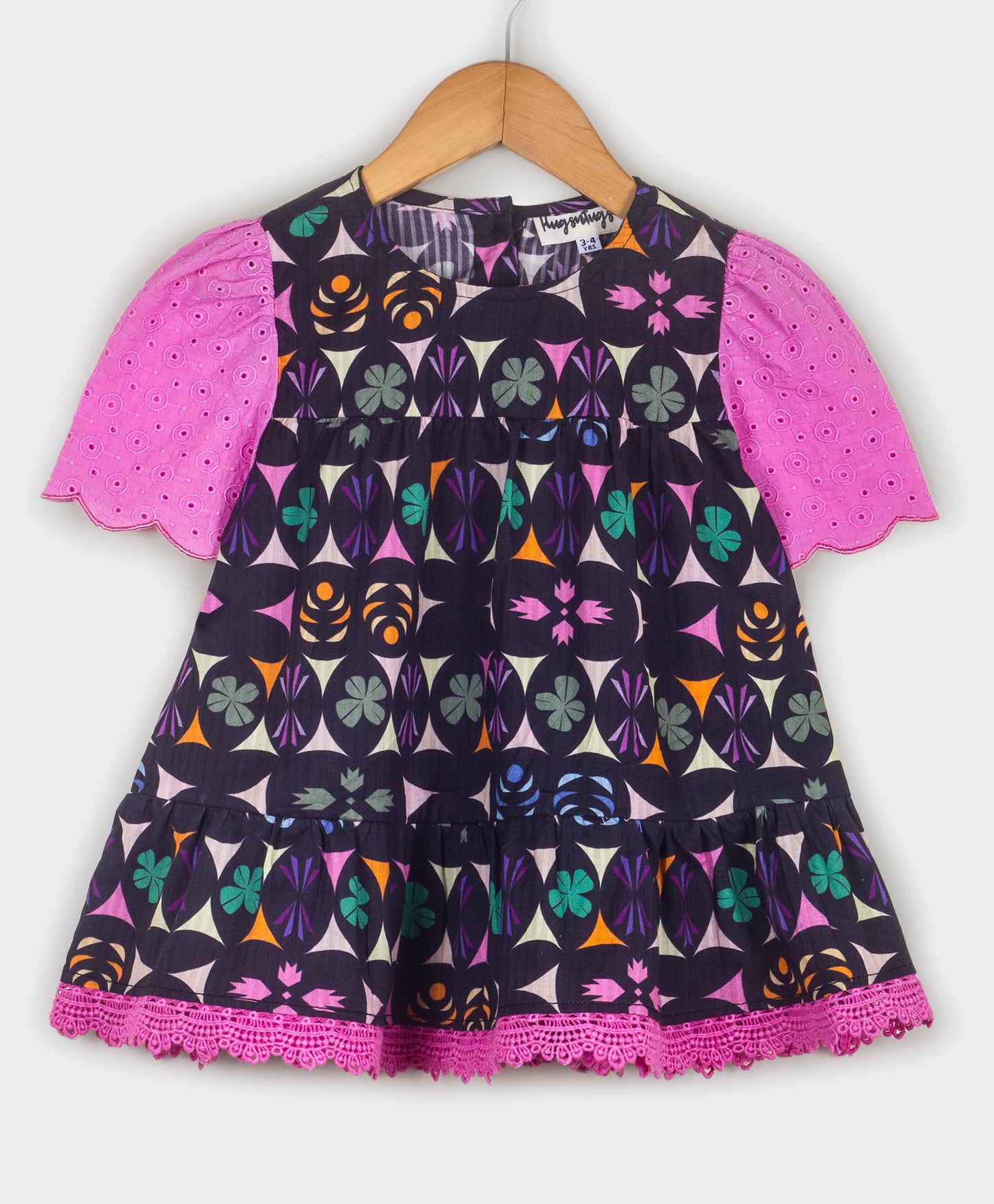 Kaleidoscopic print top with schiffli sleeves