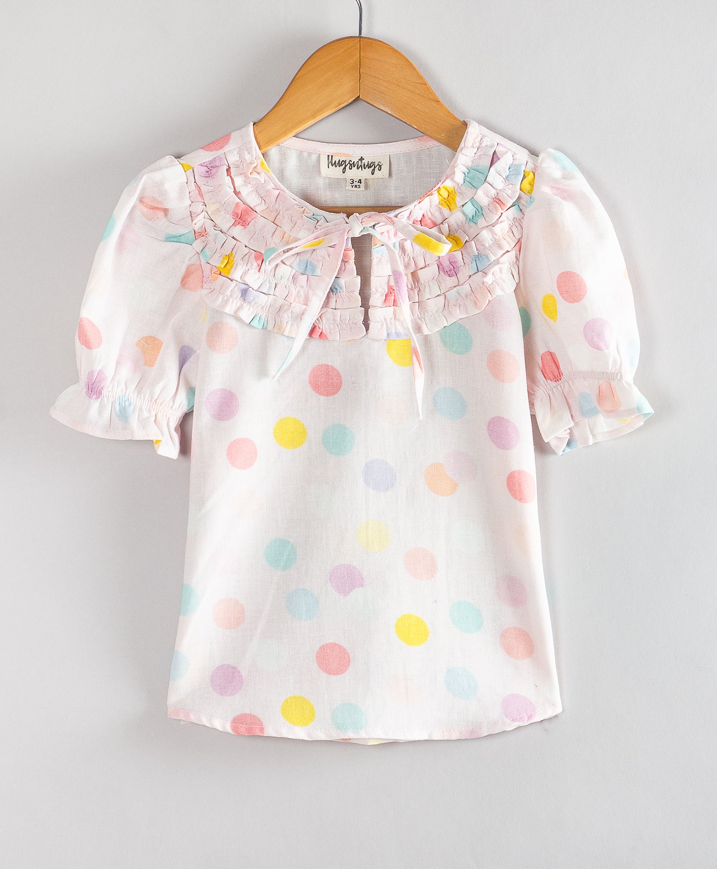 PINK DOT PRINT TOP WITH FRONT RUFFLES