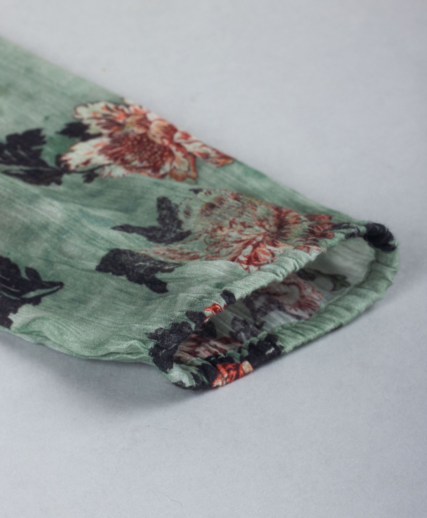 GREEN FLORAL PRINTED TOP WITH FRONT SIDE FRILLS