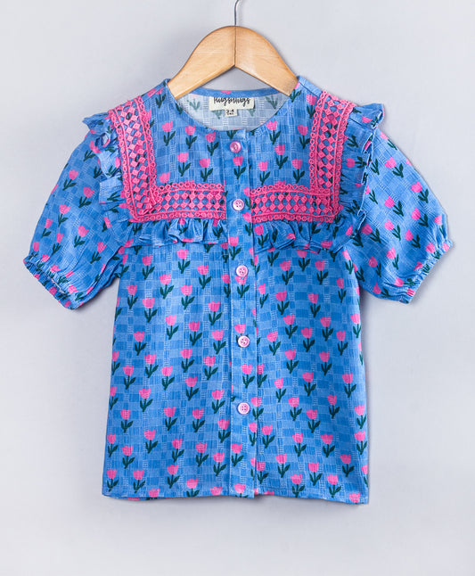 BLUE TOP WITH ALL OVER PINK TULIP PRINT AND PINK LACES