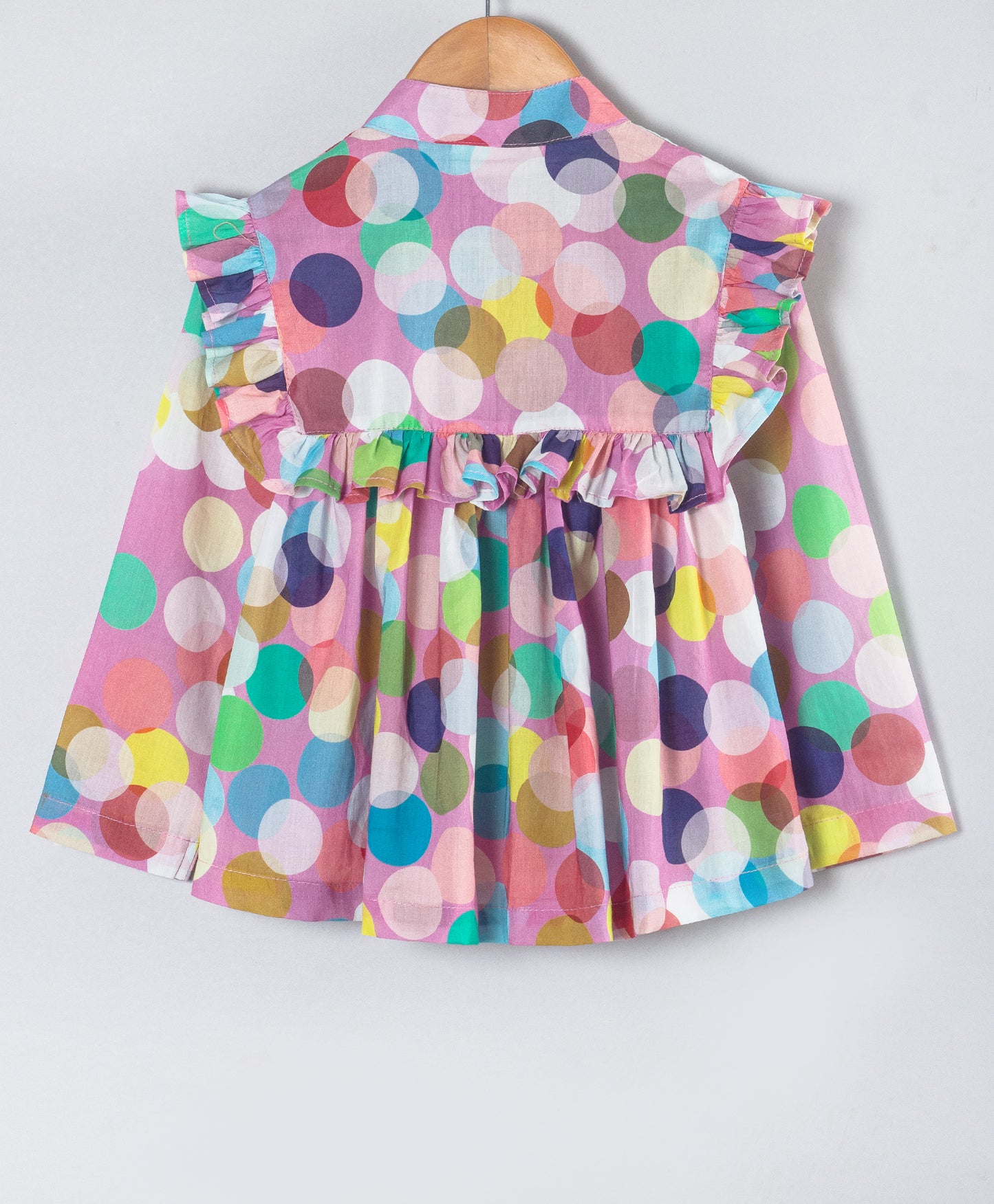 MULTI DOT PRINT TOP WITH FRILLS ALONG YOKE