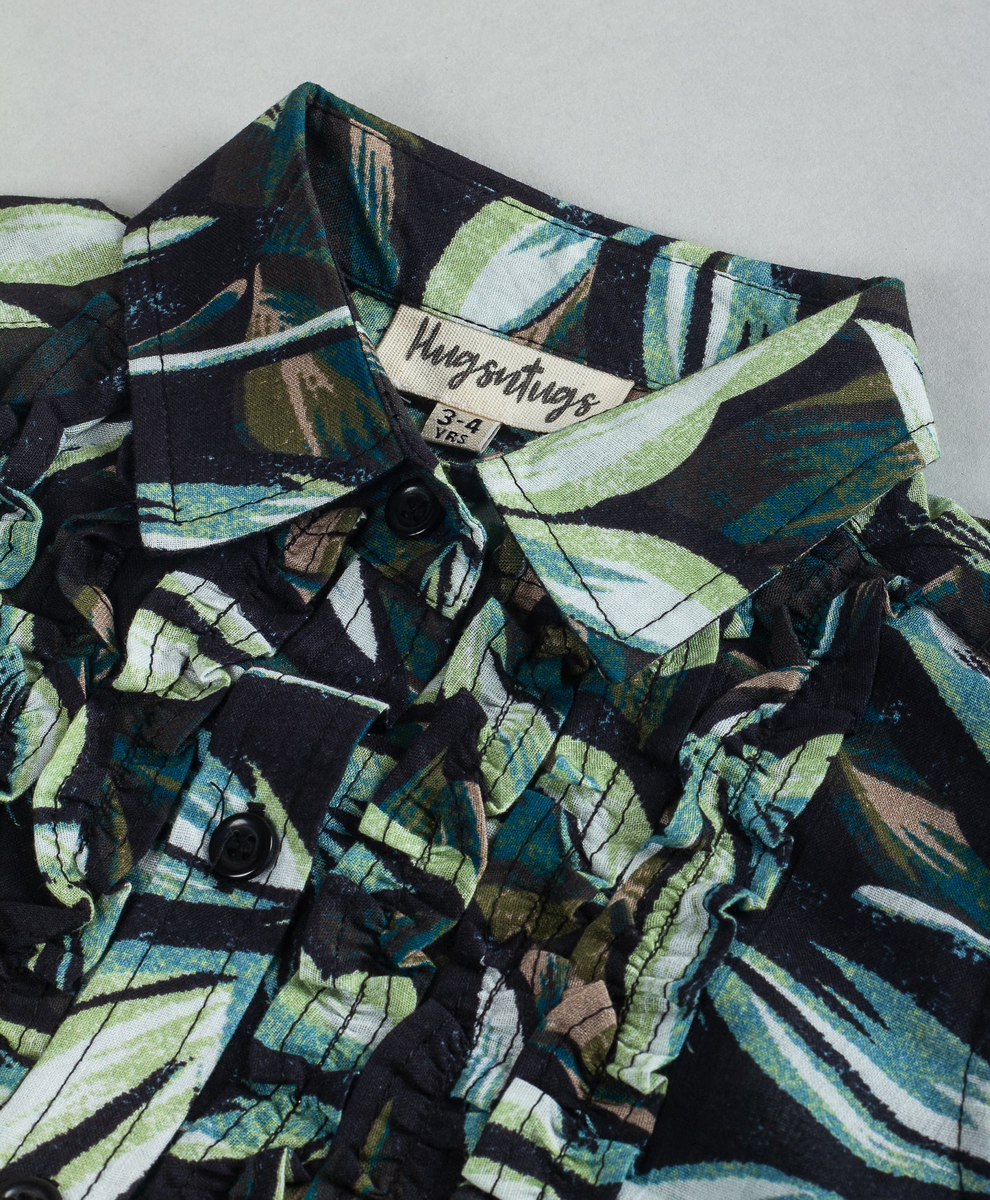 LEAF PRINT TOP WITH RUFFLES AT FRONT