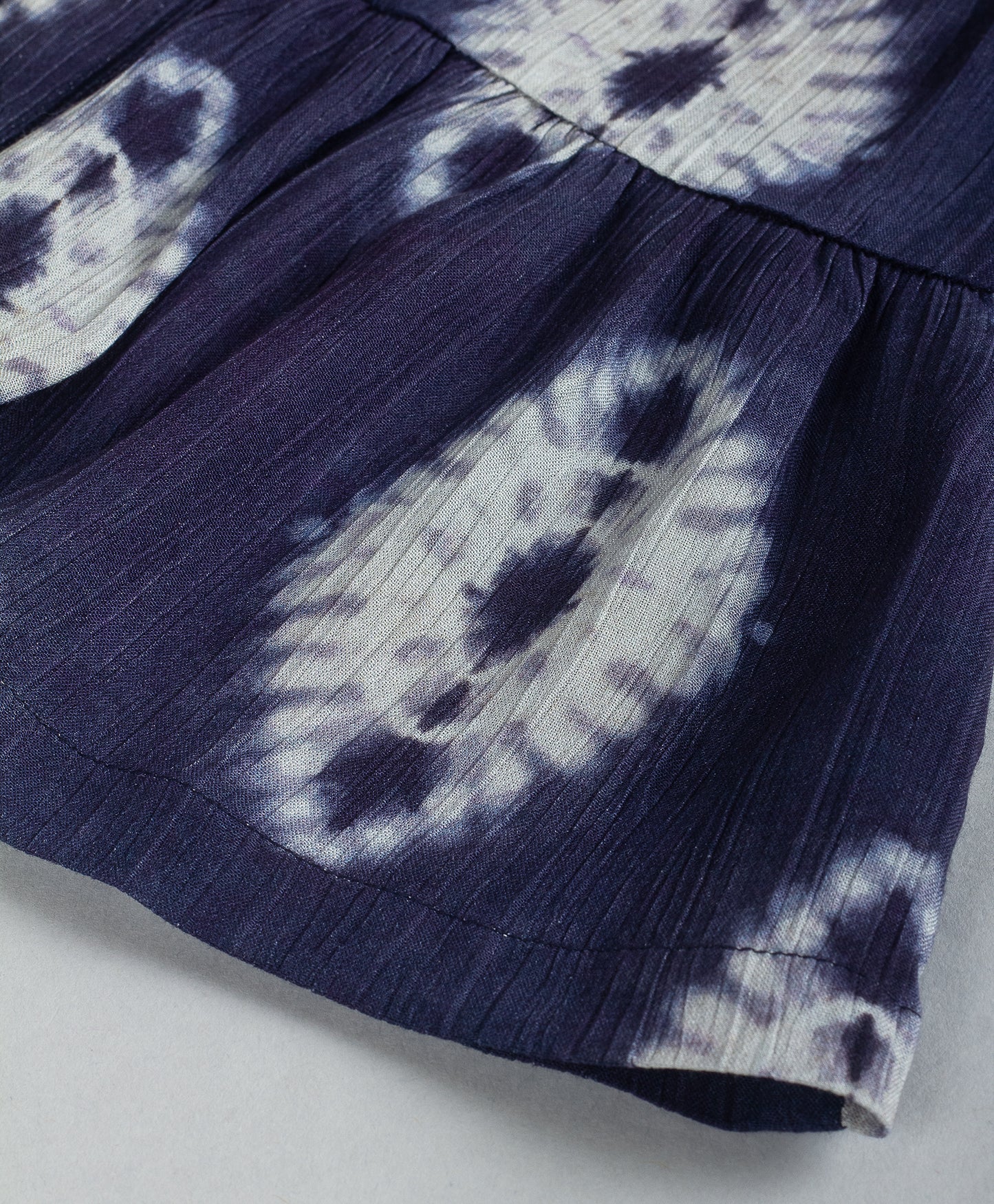 NAVY TIE DYE PRINT TOP WITH BOW TIE AT  FRONT NECK