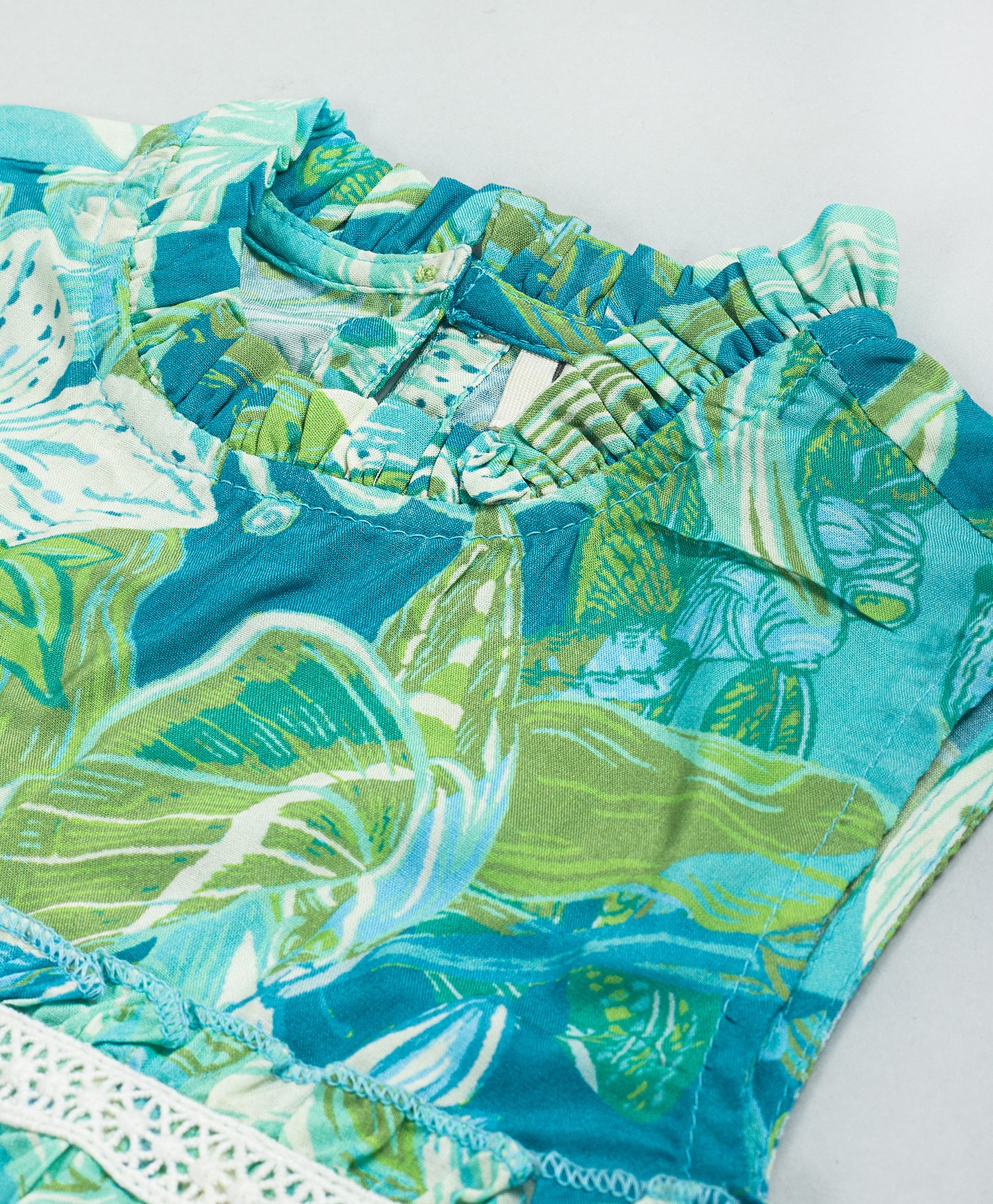 GREEN BLUE ALL OVER LEAF PRINT TOP WITH LACE AT WAIST