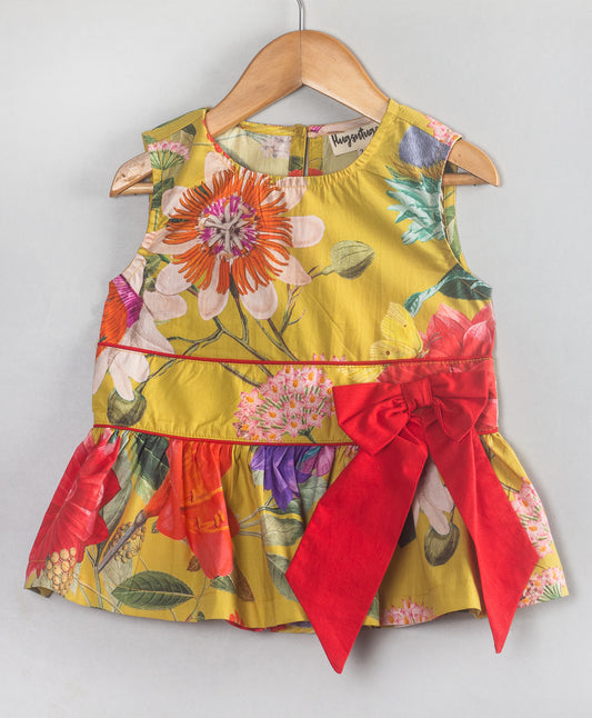 YELLOW FLORAL PRINT TOP WITH RED BOW AT WAIST