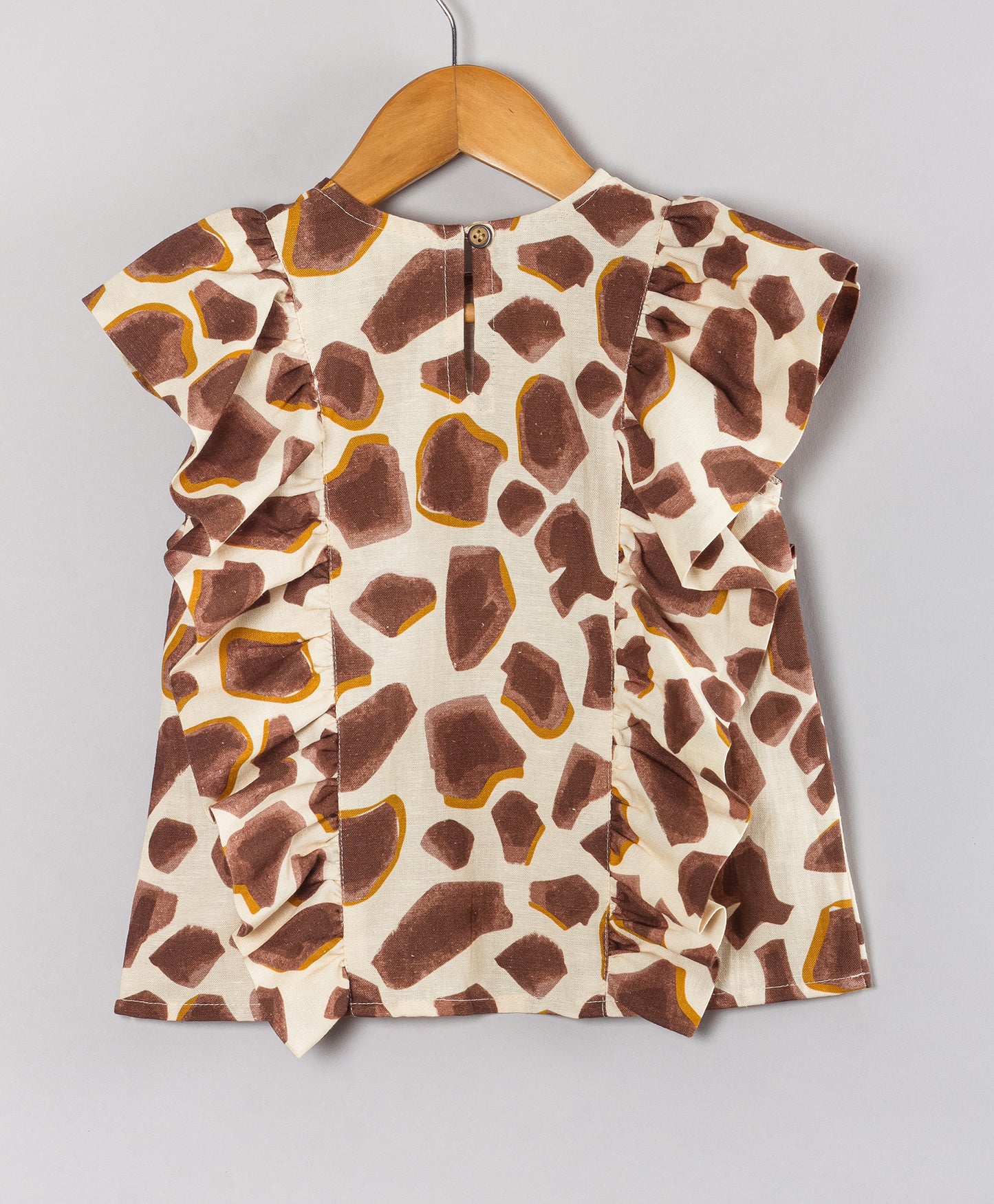 ABSTRACT PEBBLE PRINT TOP WITH SIDE FRILLS