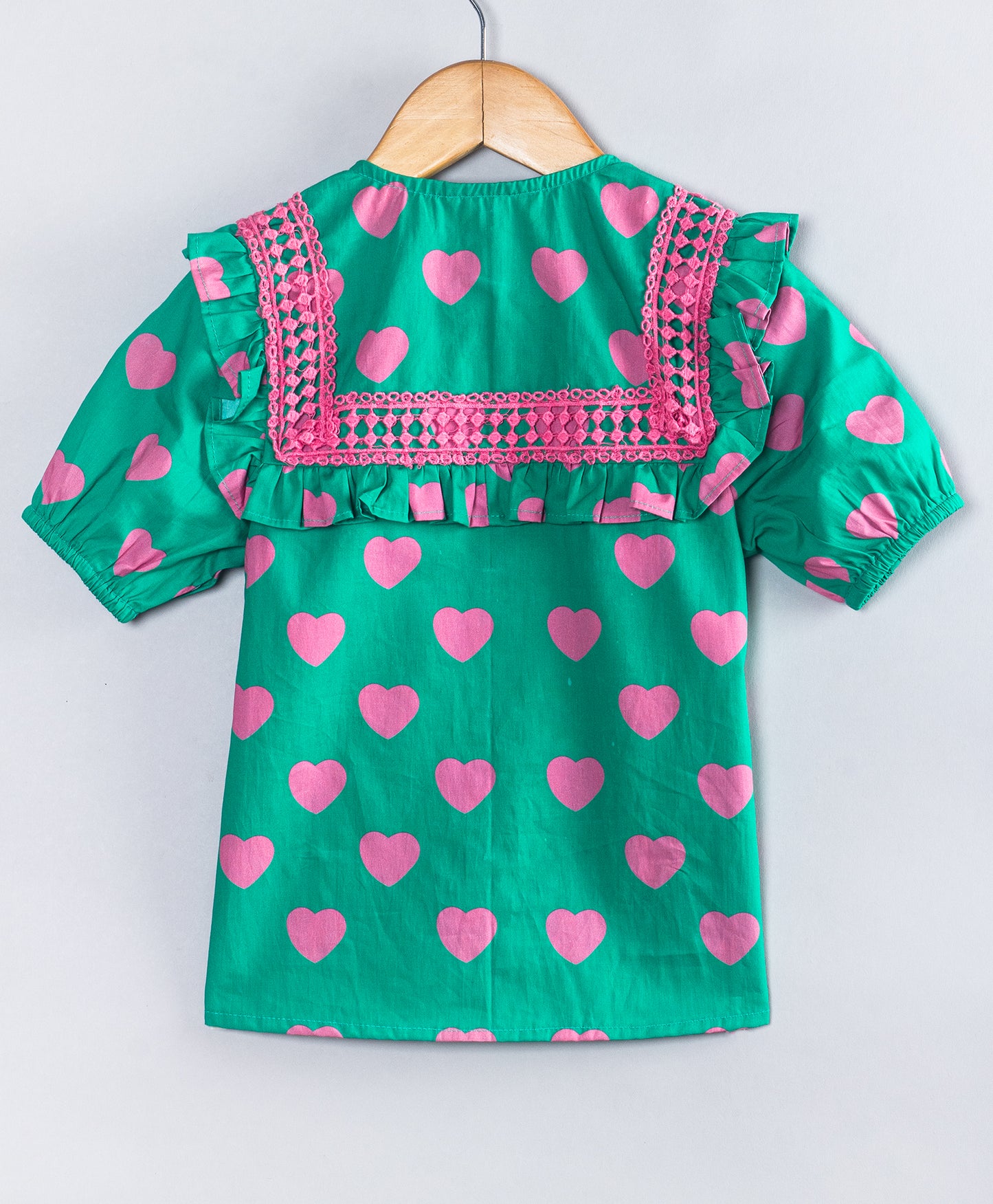 GREEN TOP WITH PINK HEART PRINT AND PINK LACE