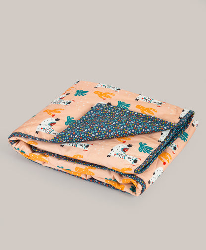 LLAMA PRINT AC QUILT WITH DITSY FLORAL PRINT LINING.
