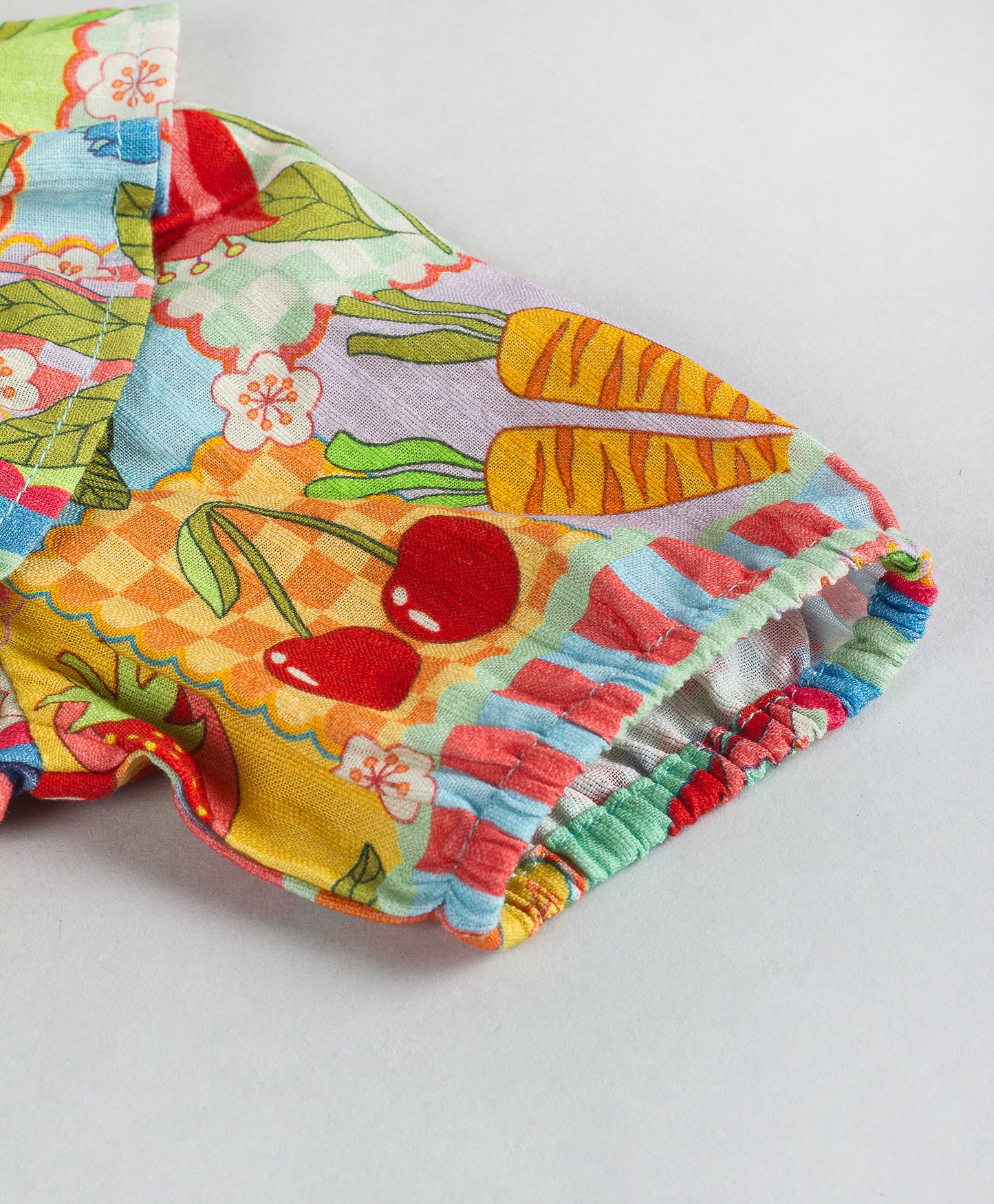 BUSY PRINT WITH CENTRE FRONT SCALLOP DETAILING