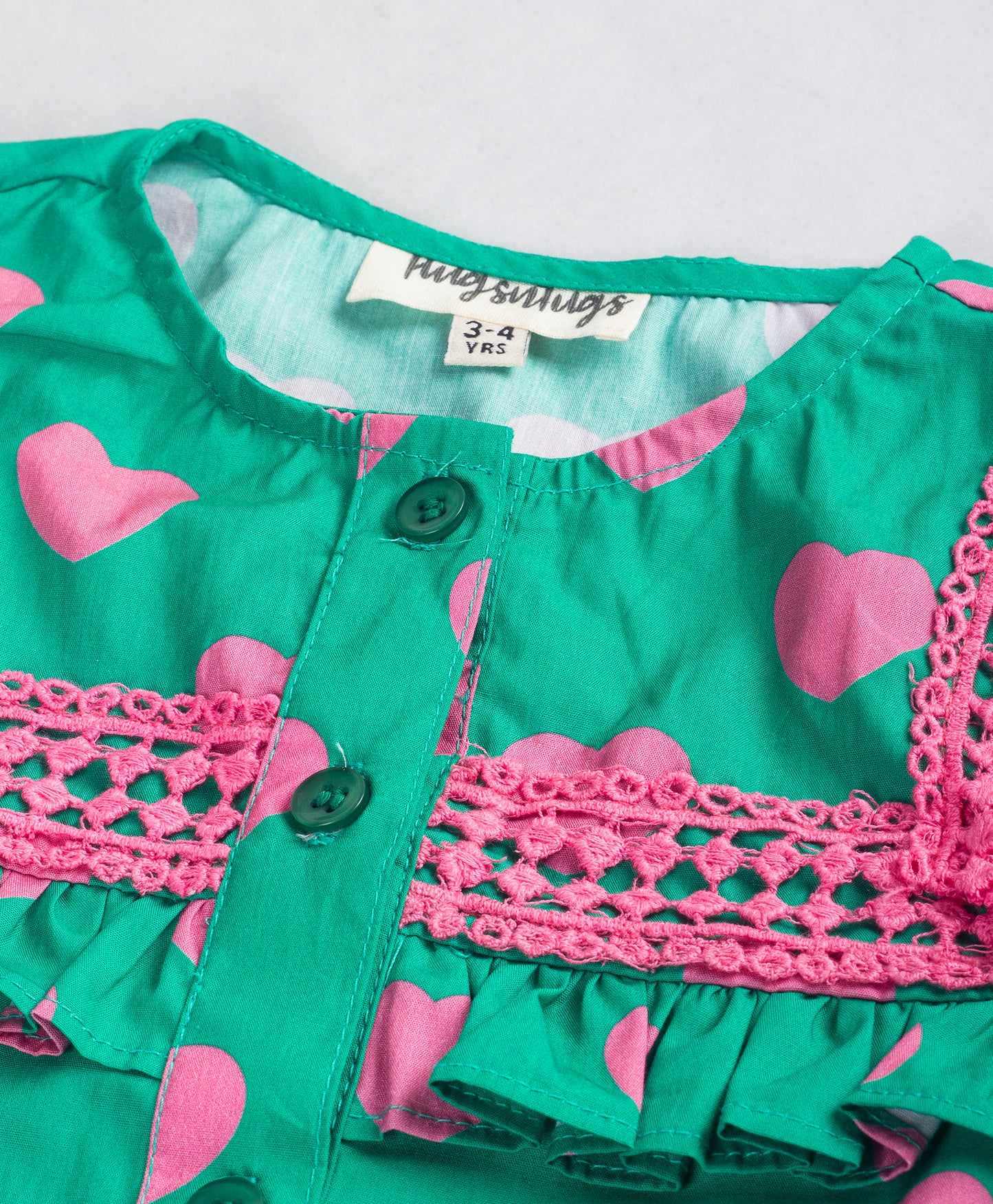 GREEN TOP WITH PINK HEART PRINT AND PINK LACE