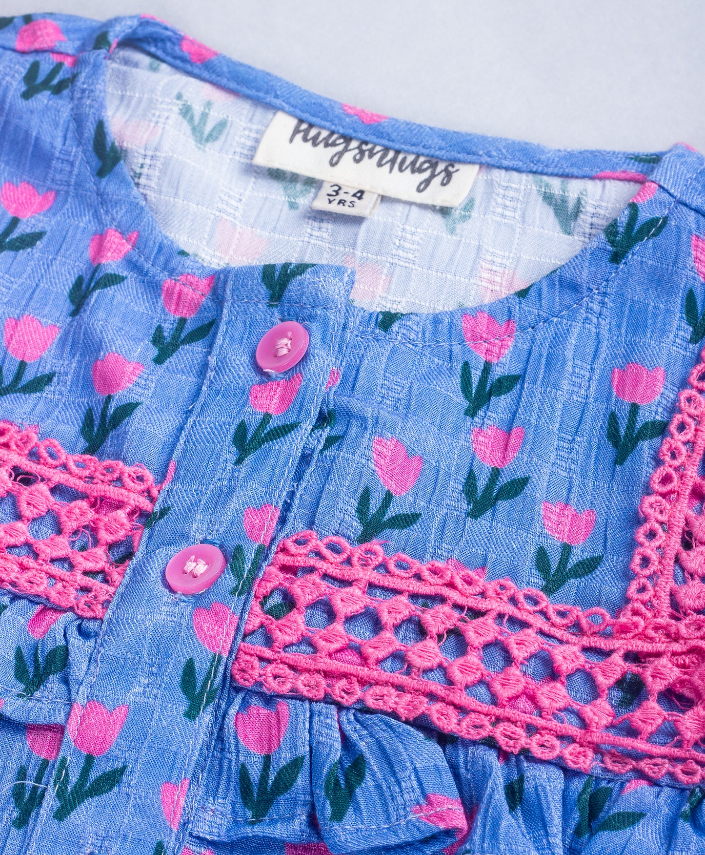 BLUE TOP WITH ALL OVER PINK TULIP PRINT AND PINK LACES